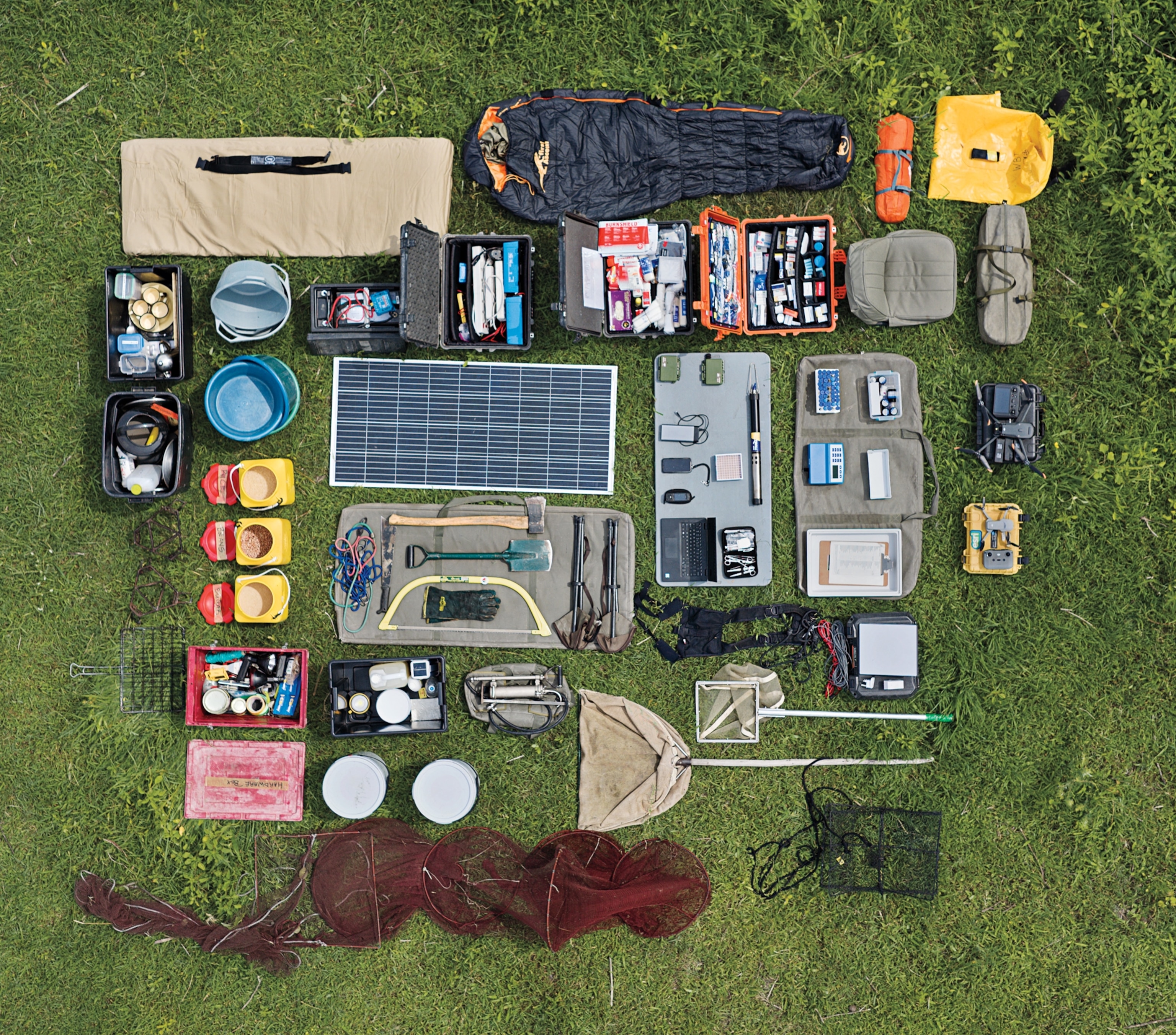 The gears which must be carefully loaded into one canoe, including solar panel, nets, sleeping bags, lab equipments and much more.