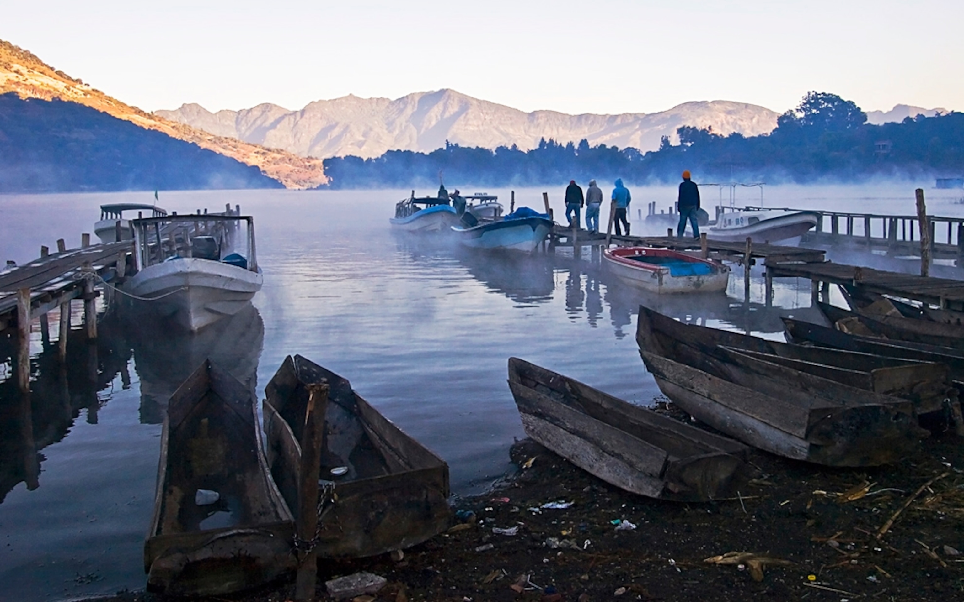 Maya men unloading cargo, Lake Atitlan, Guatemala