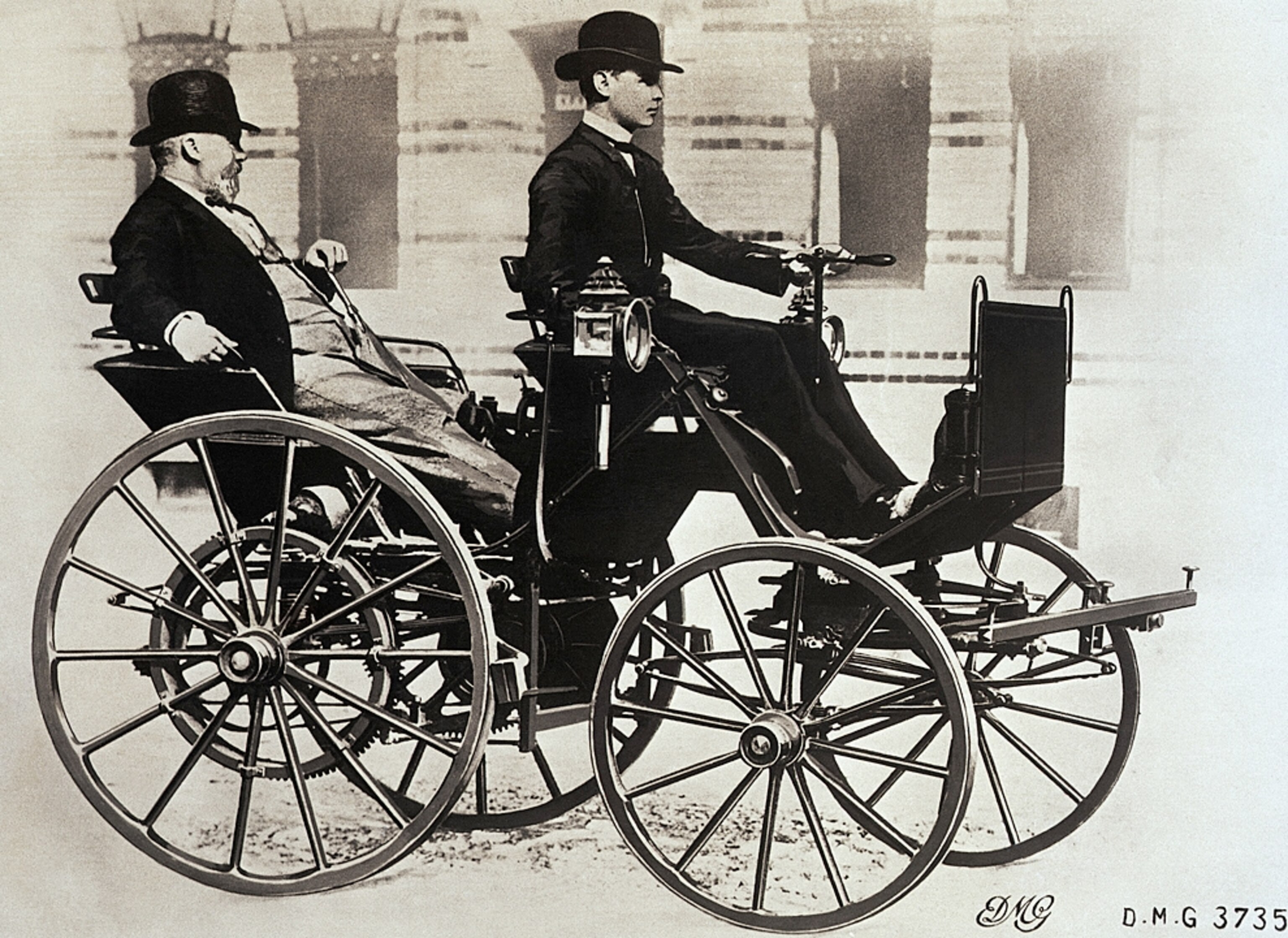 Gottlieb Daimler riding in early automobile