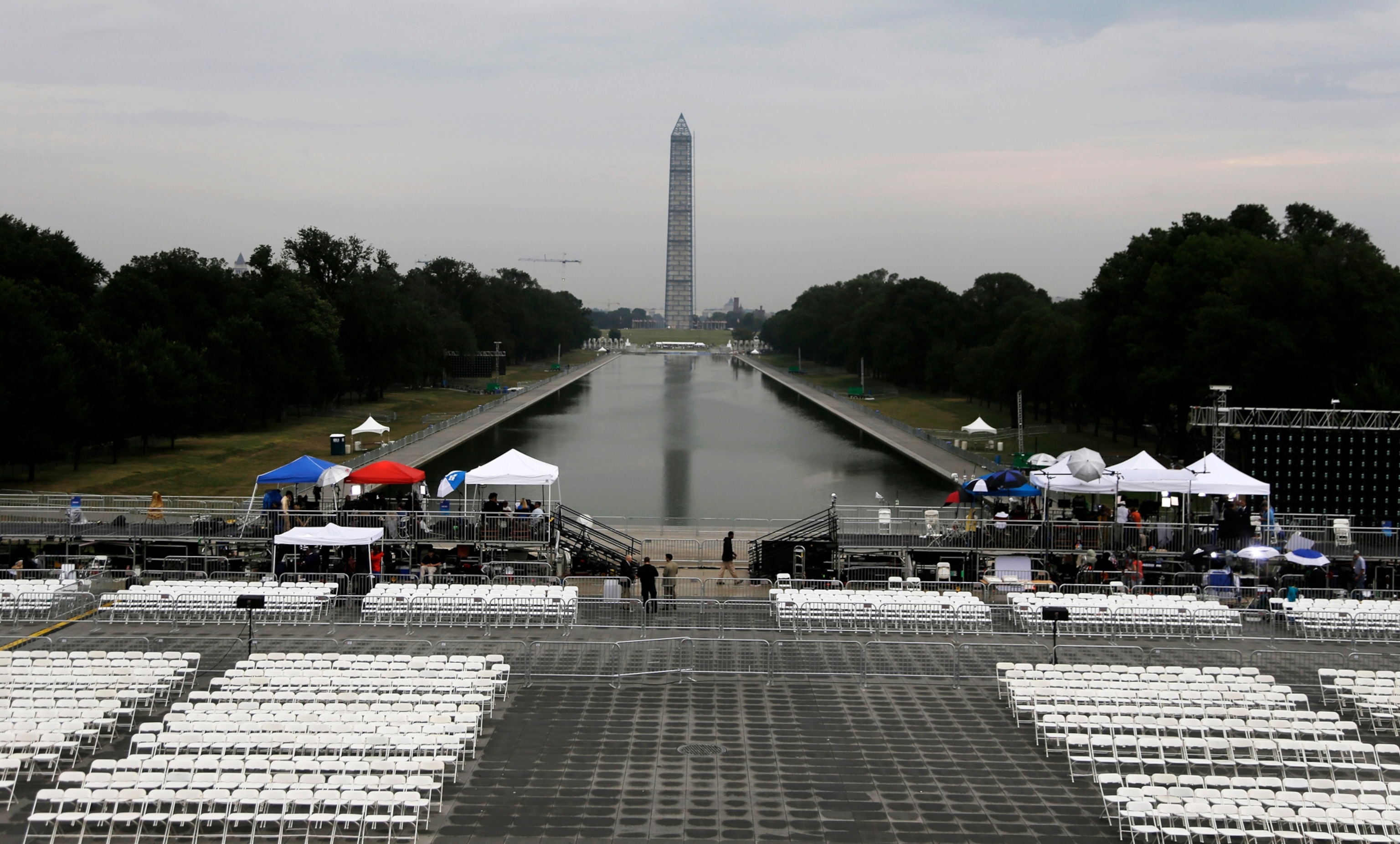 Before the crowds arrive the Washington Monument and the Reflecting Pool are seen as media prepares for Let Freedom Ring ceremony on the steps of the Lincoln Memorial in Washington, Wednesday, Aug. 28, 2013, to commemorate the 50th Anniversary of the 1963 March on Washington for Jobs and Freedom. (AP Photo/Carolyn Kaster)