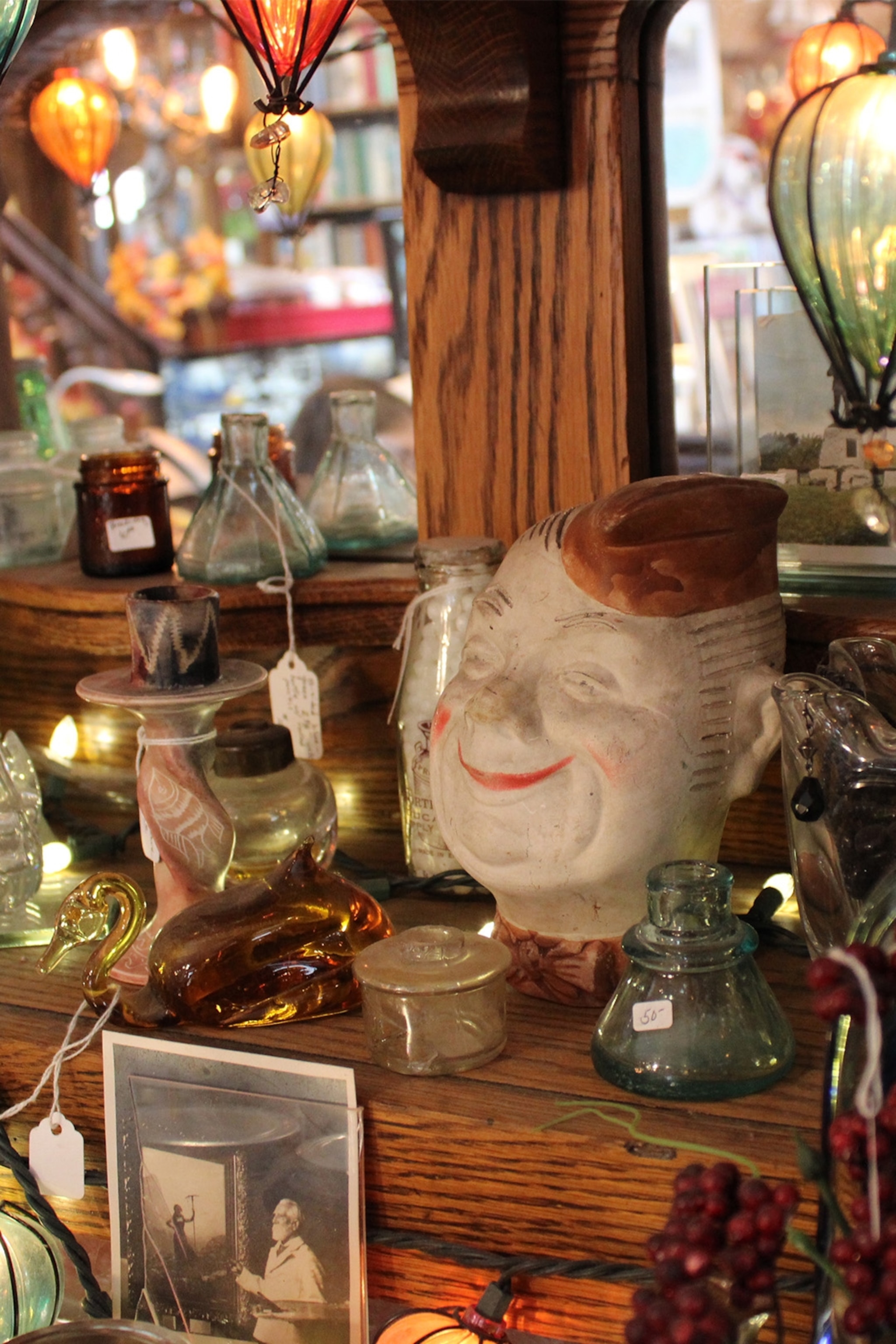 a variety of second hand curiosities on a shelf