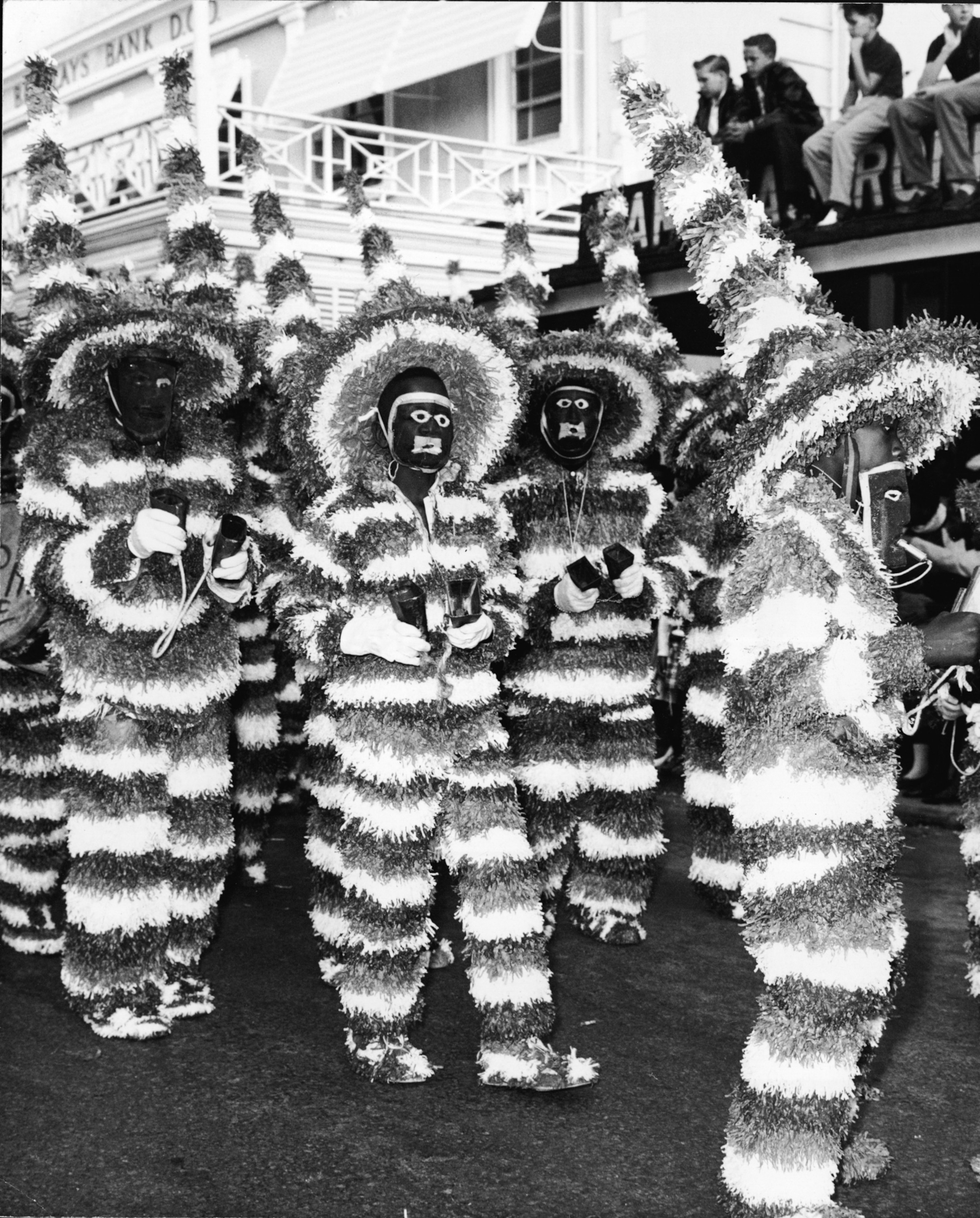 A black and white images of full garbed performer.