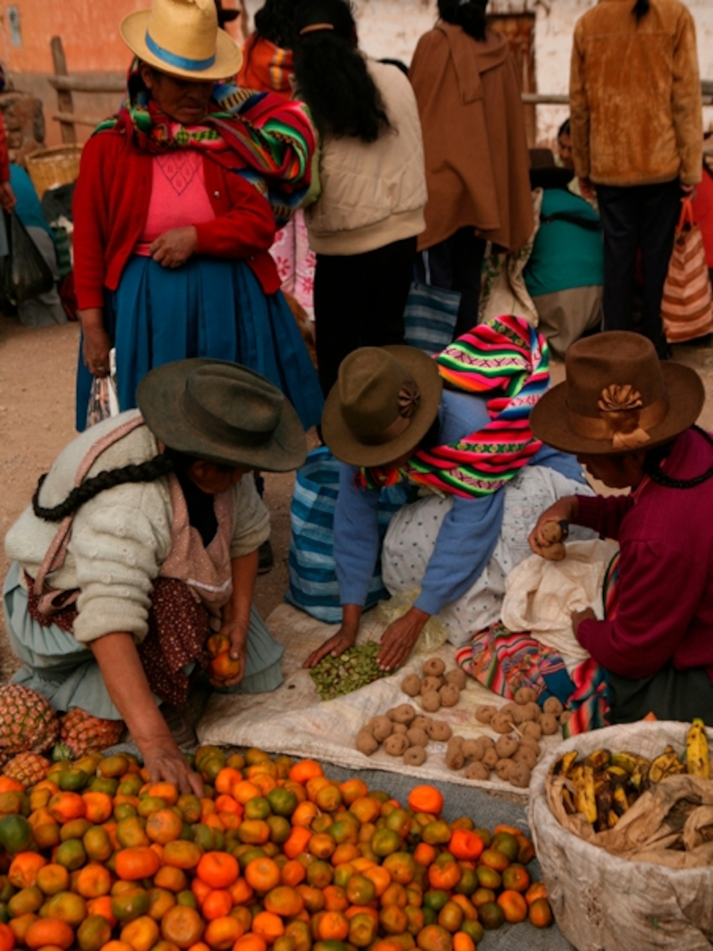 Farmers with produce at market in Chincero, Peru