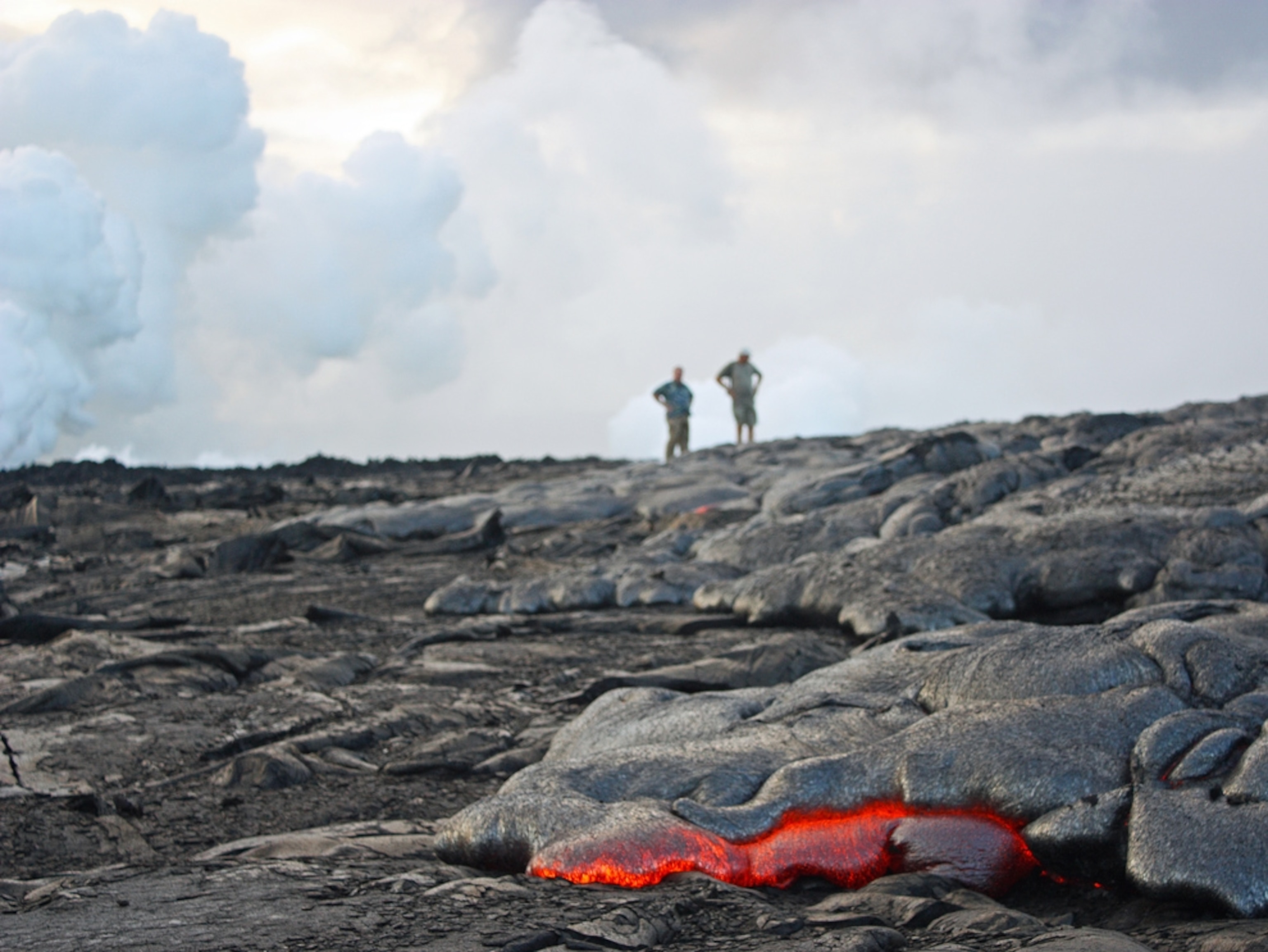 Volcano picture: Tourists walk near Kilauea Volcano in Hawaii, for a gallery on volcano tourism