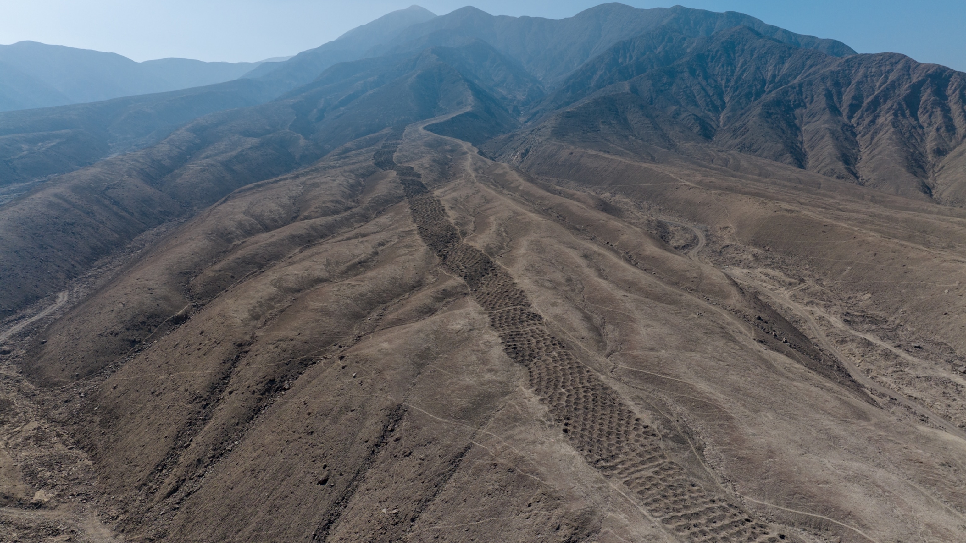 Why Did the Inca Dig Thousands of Holes in This Mountain? We May Now Know.
