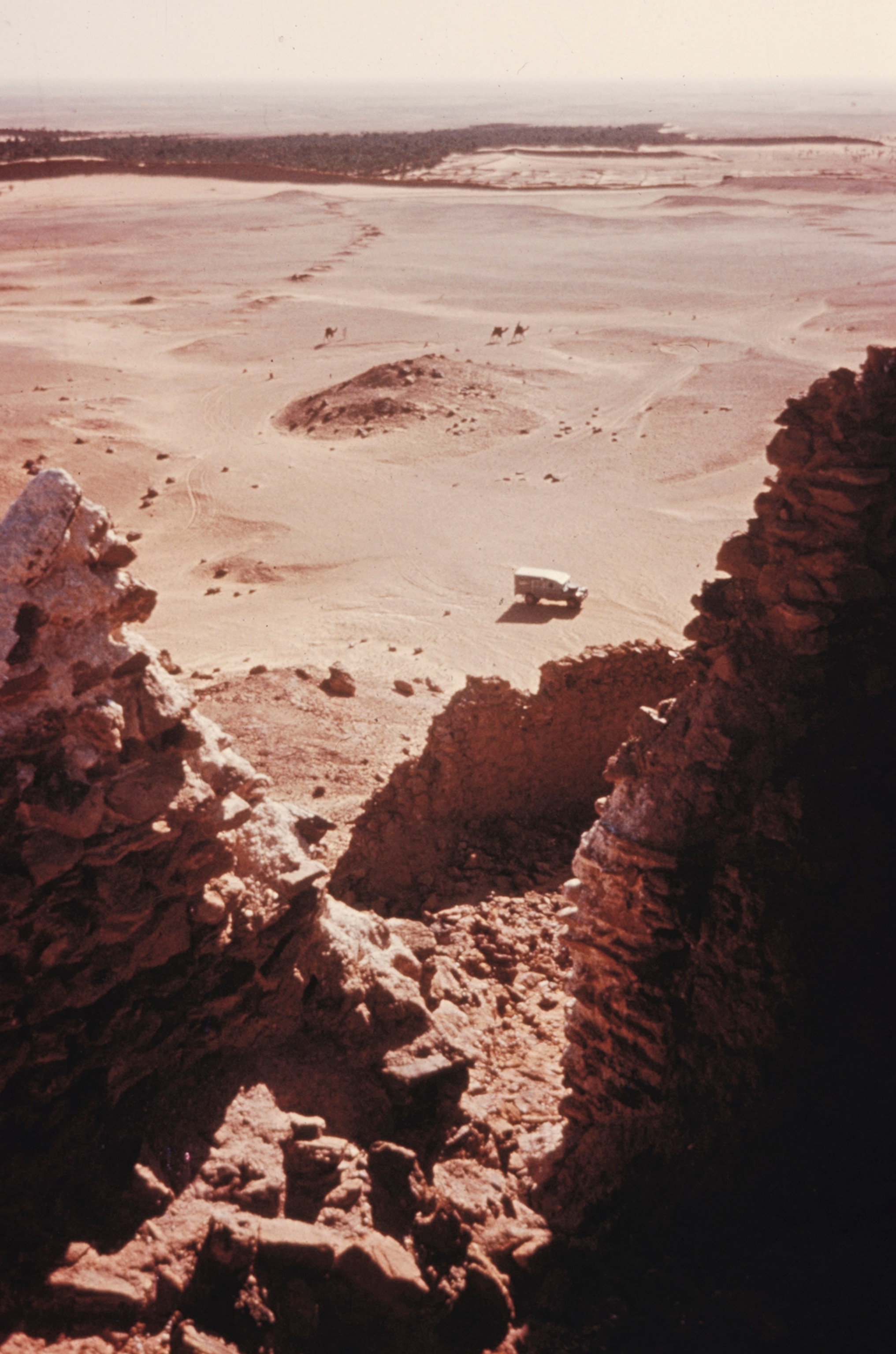 A view of an English Land-Rover driving through the Sahara desert