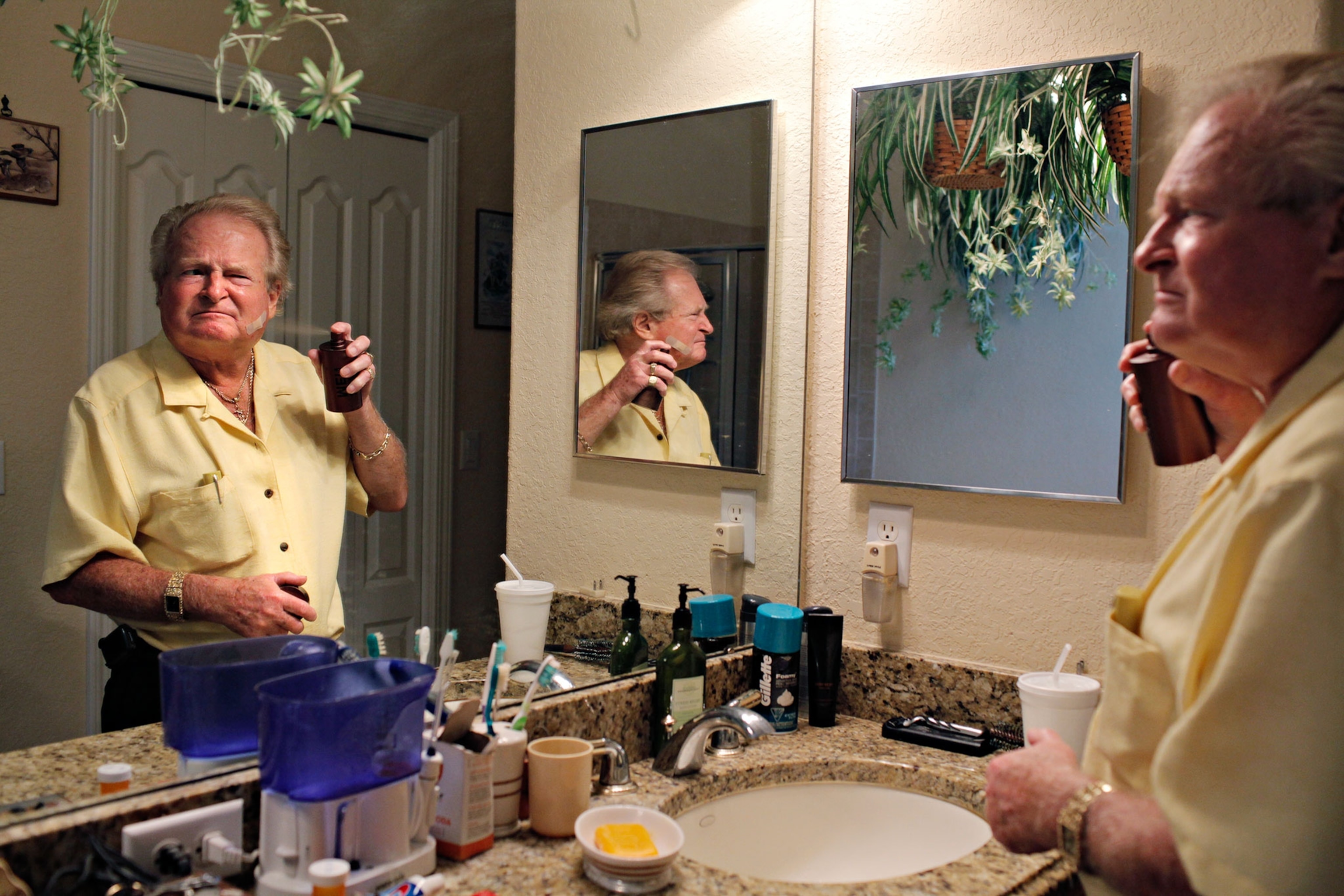 man getting ready in bathroom