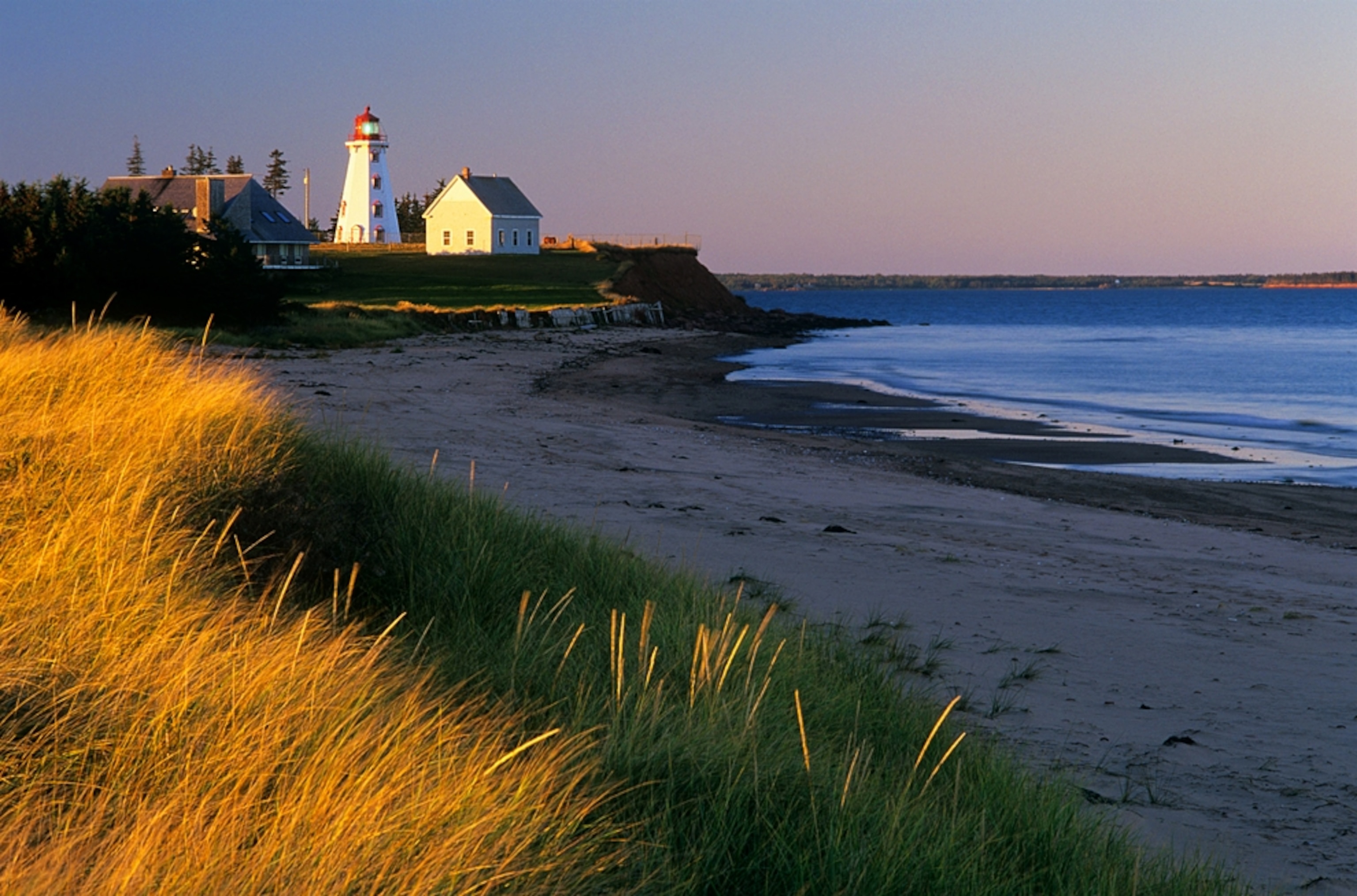 a lighthouse at low tide in Panmure Island Provincial Park, Prince Edward Island, Canada