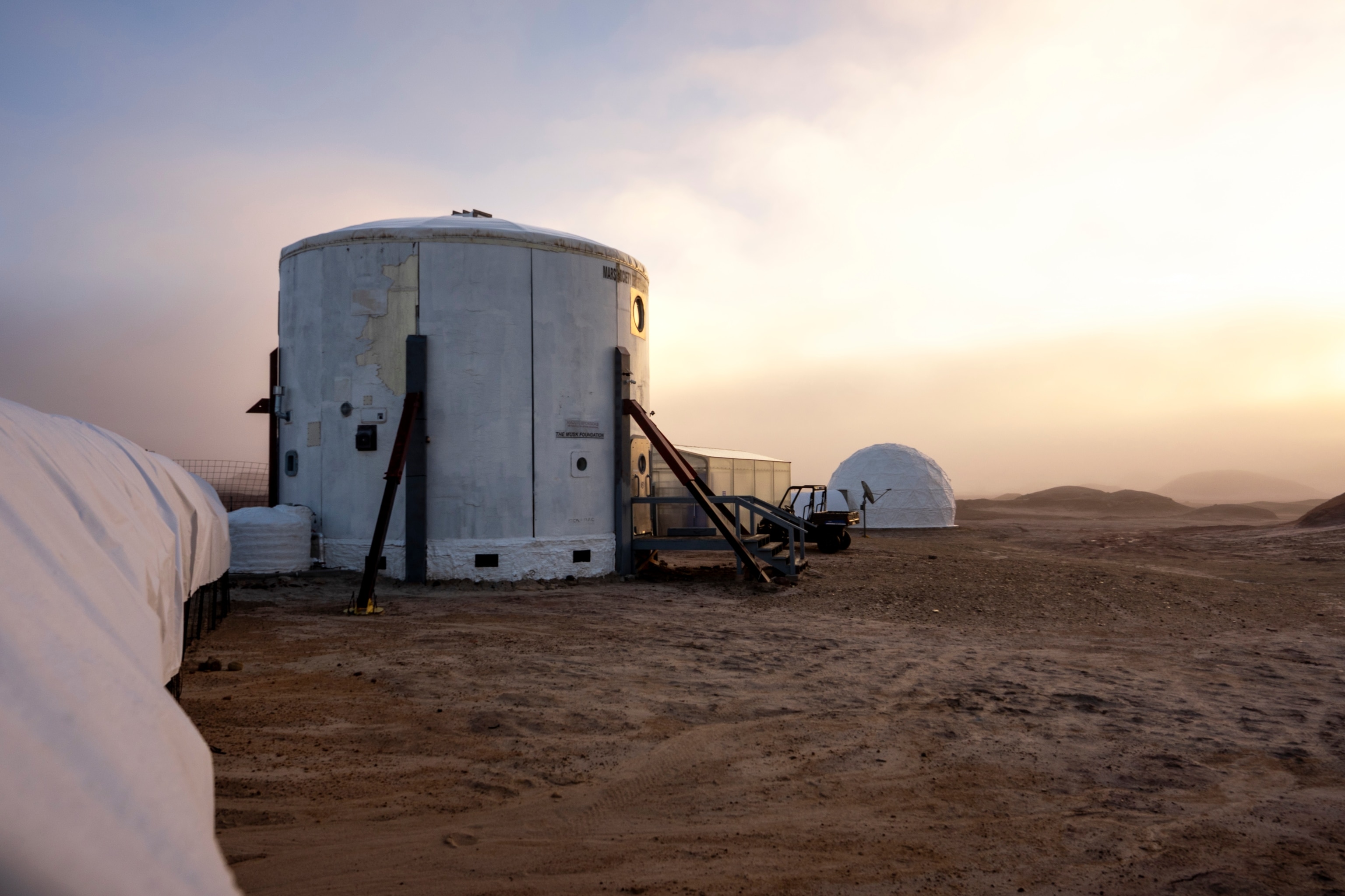 View of Mars Desert Research Station on Sol 12 outside of Hanksville, Utah on October 24, 2025. The crew consists of analog astronauts Commander Rym Chaïd, Crew Scientist and Health & Safety Officer Shriya Musuku, Crew Engineer Ricardo J. Gonzalez, and the Crew Journalist Mackenzie Calle.