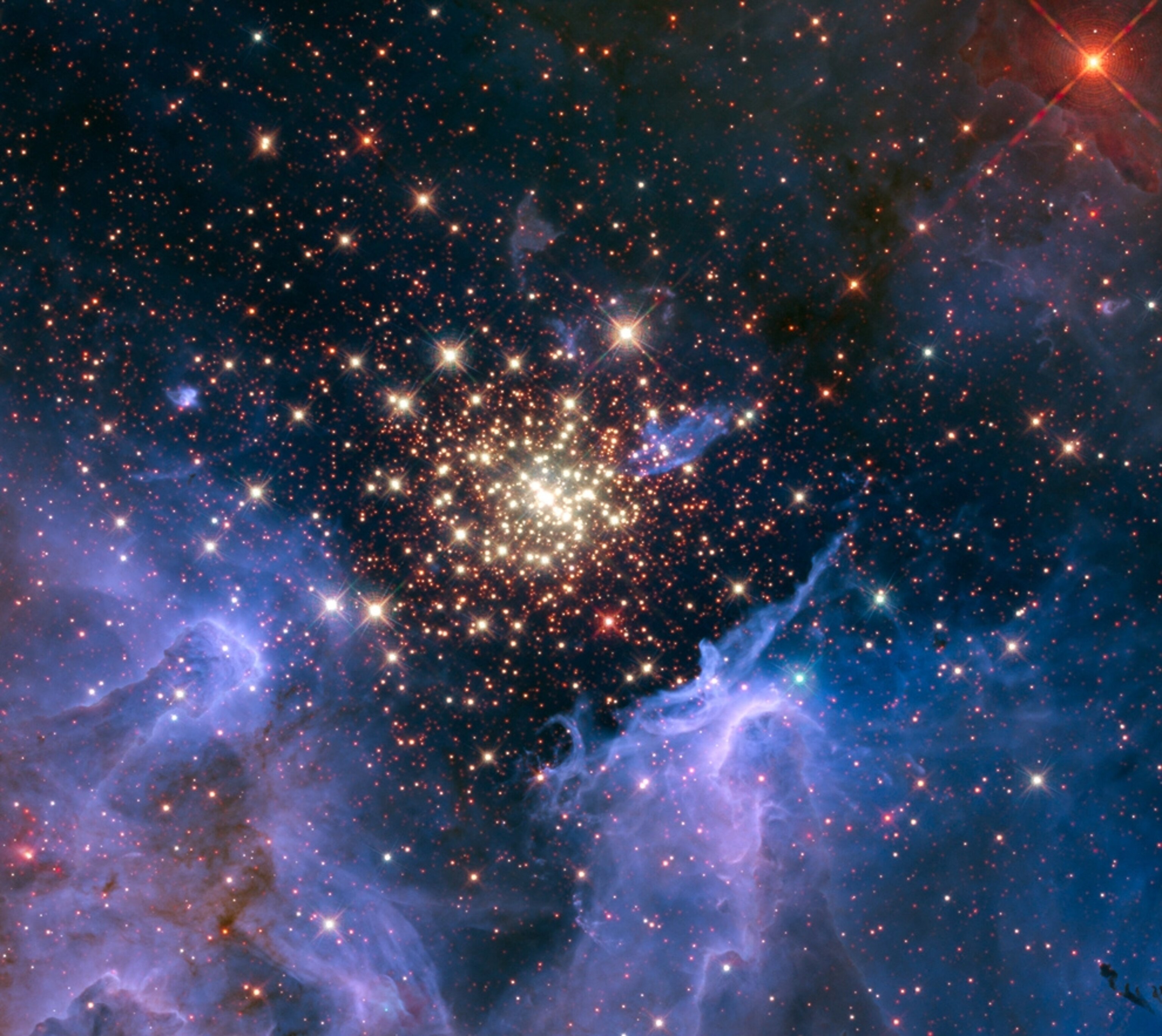 Picture of a bright star cluster surrounded by gas and dust.
