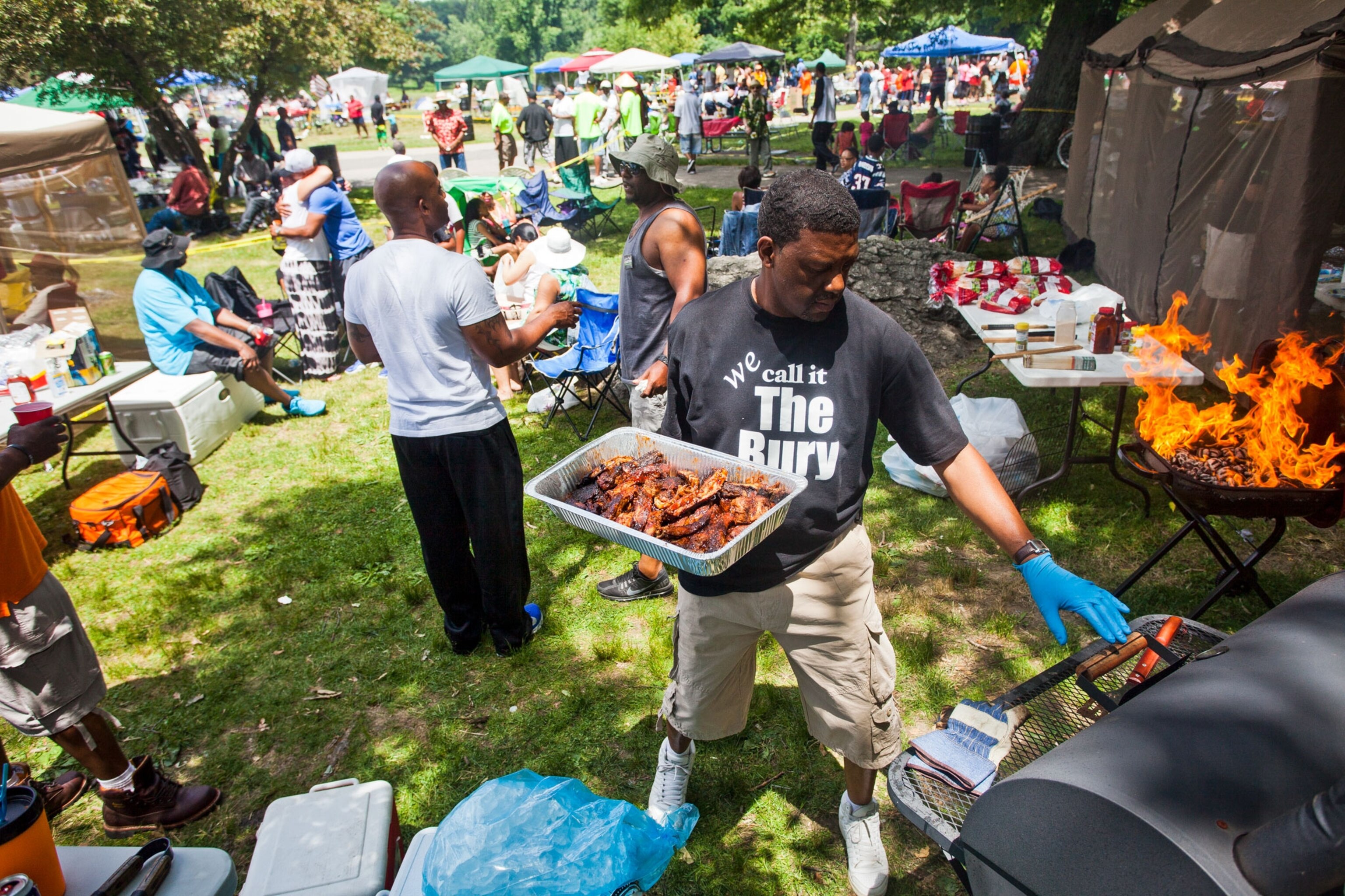 a man cooking at a Juneteenth celebration