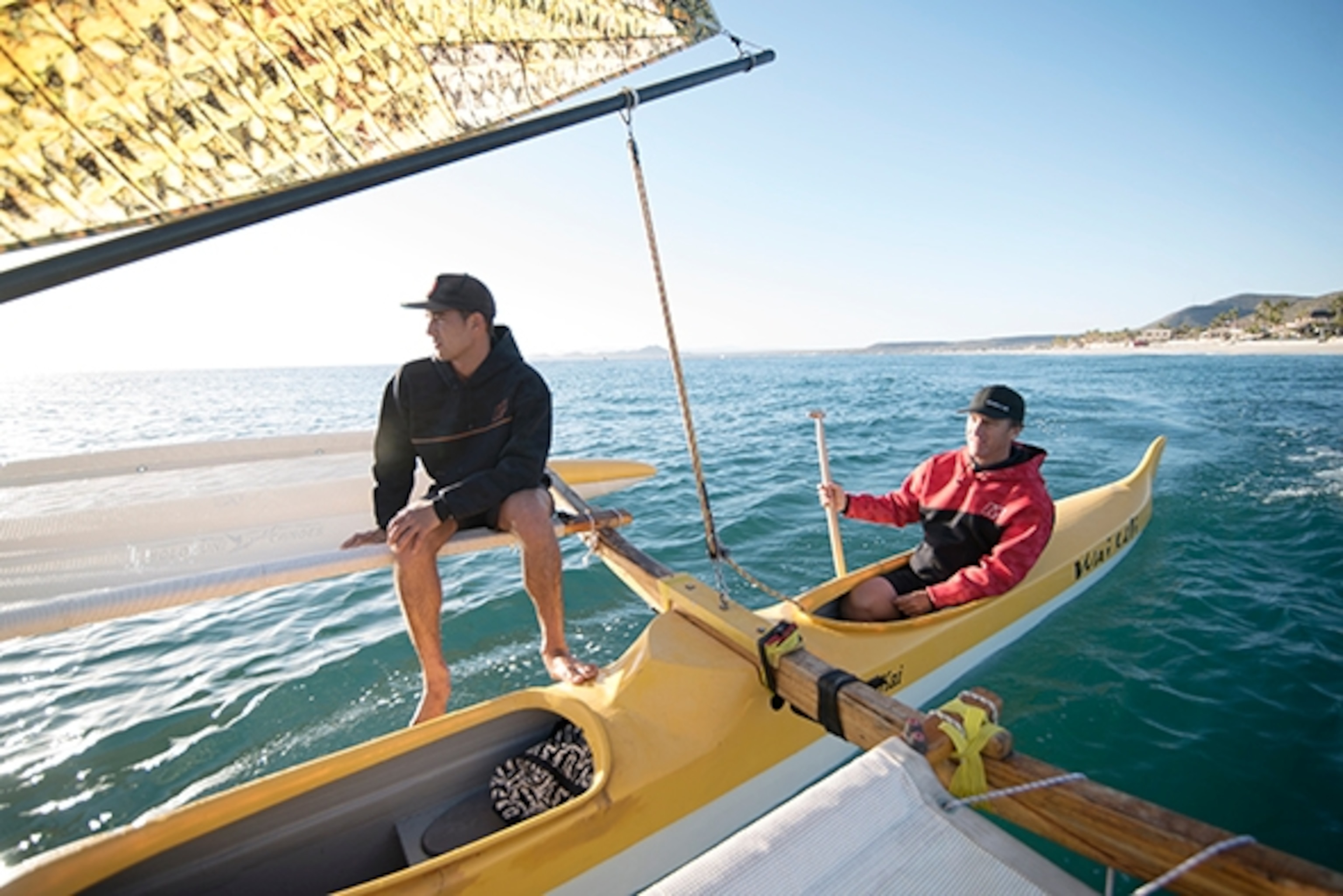 Native Hawaiian Matt Muirhead paddles with Austin Kino in the Holopuni canoe; Photograph by Max Lowe