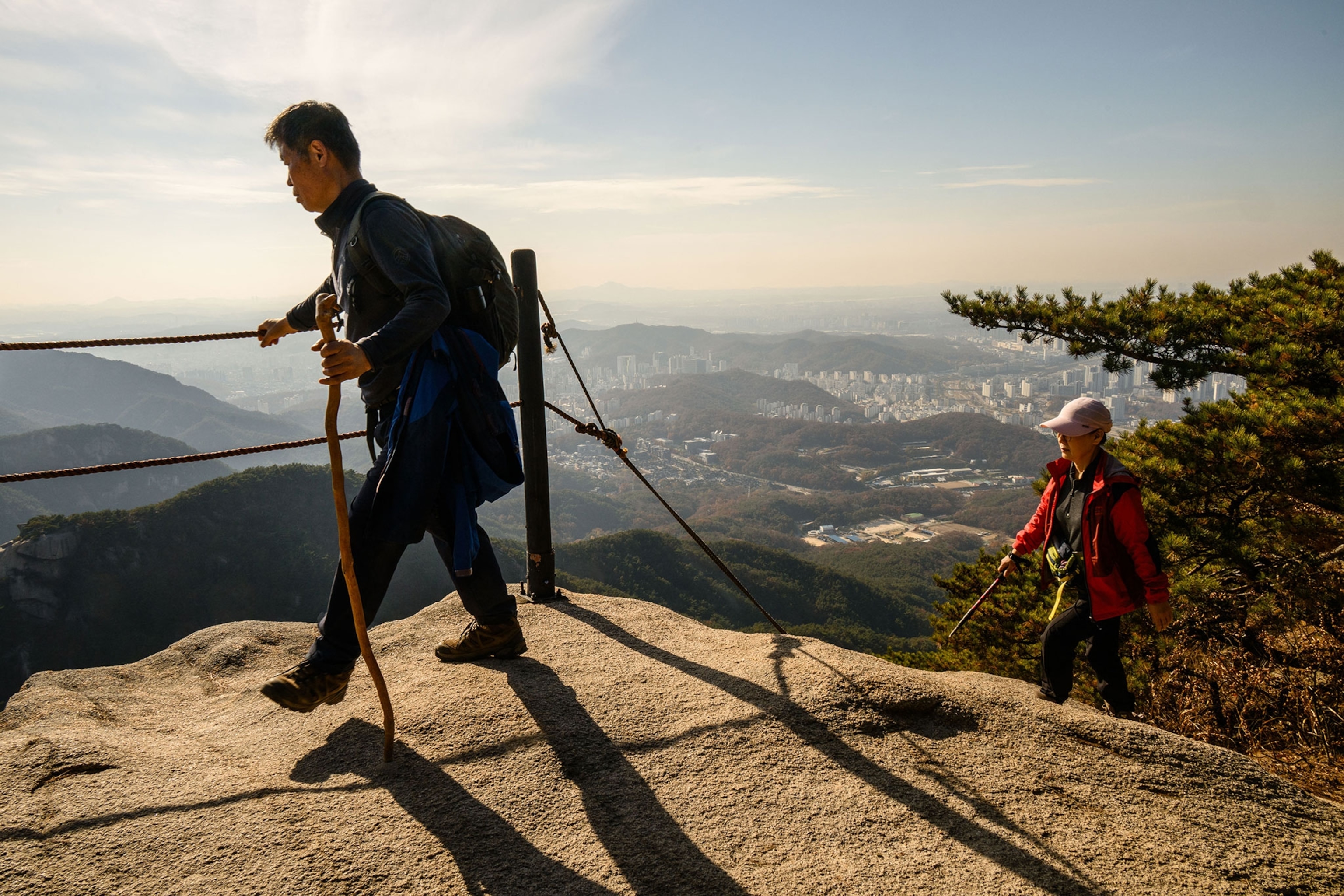 Hikers walk on the Uisangbong Peak trail in the Bukhansan National Park in Seoul.