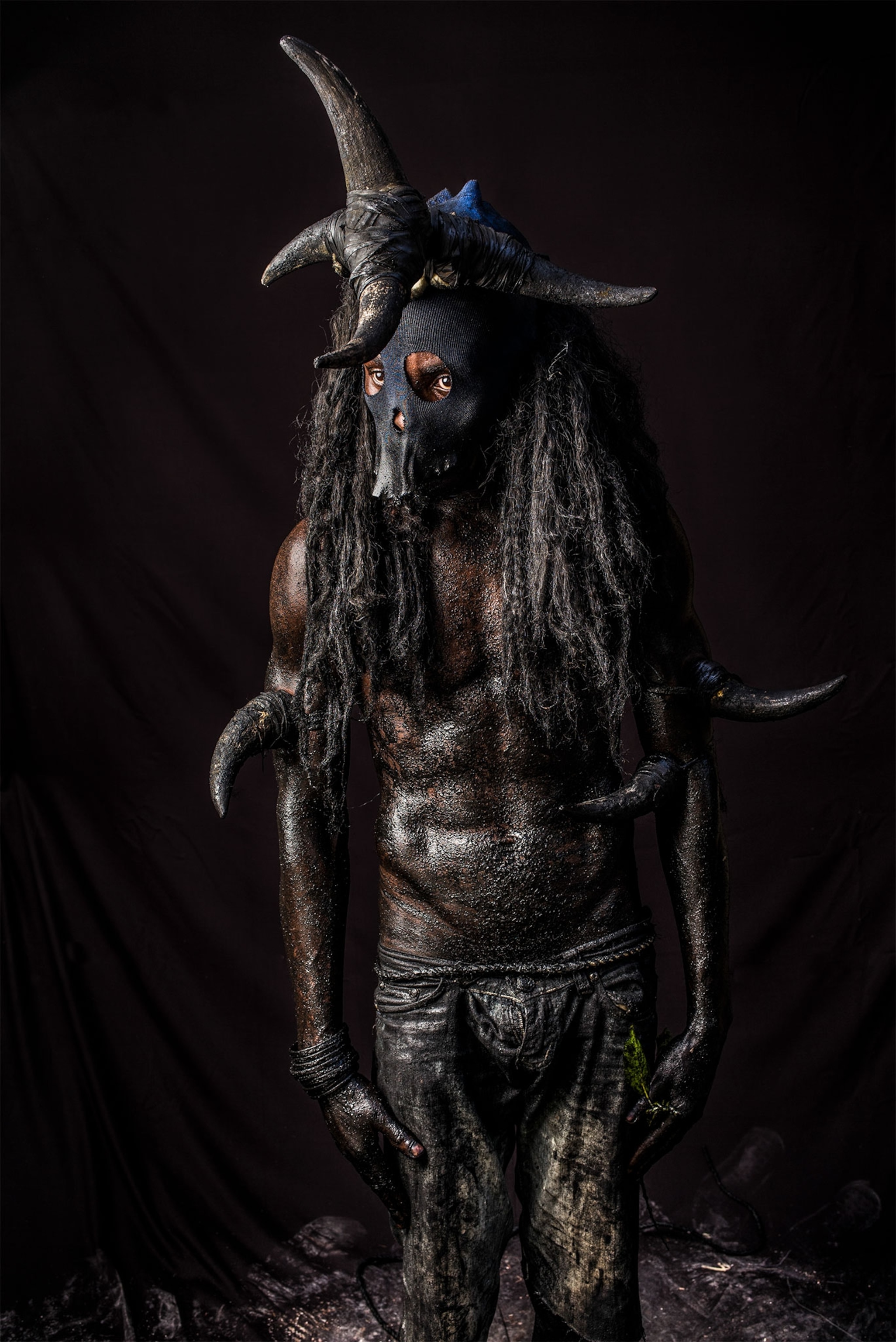 man painted black for Karnaval in Haiti