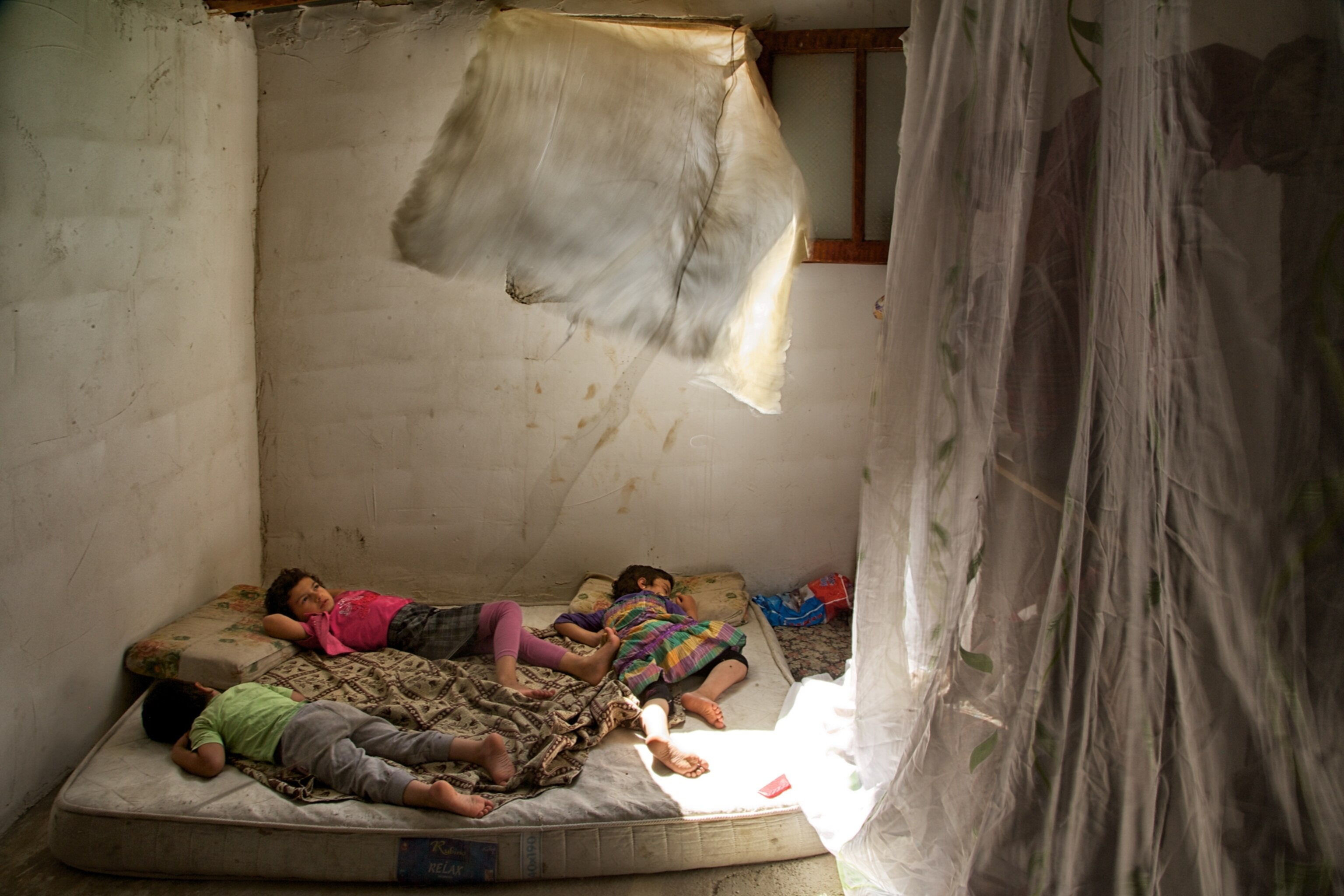 children sleeping on a farmhouse mattress