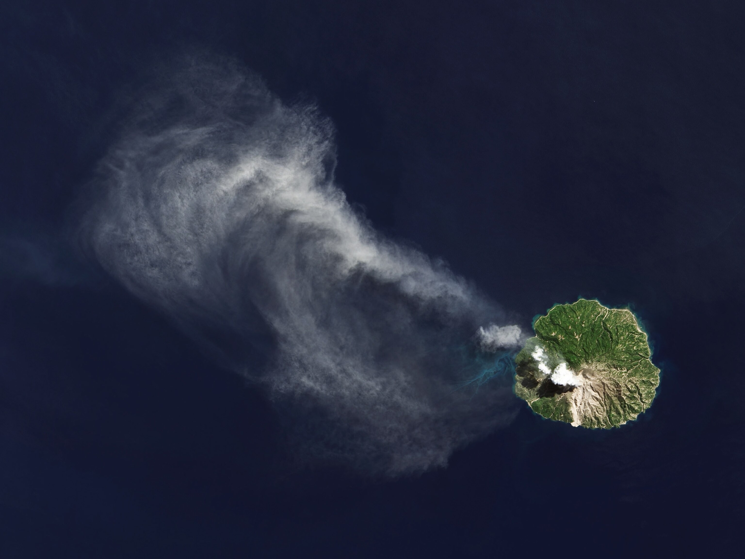 Picture taken from a satellite of a volcano in Indonesia spewing ash