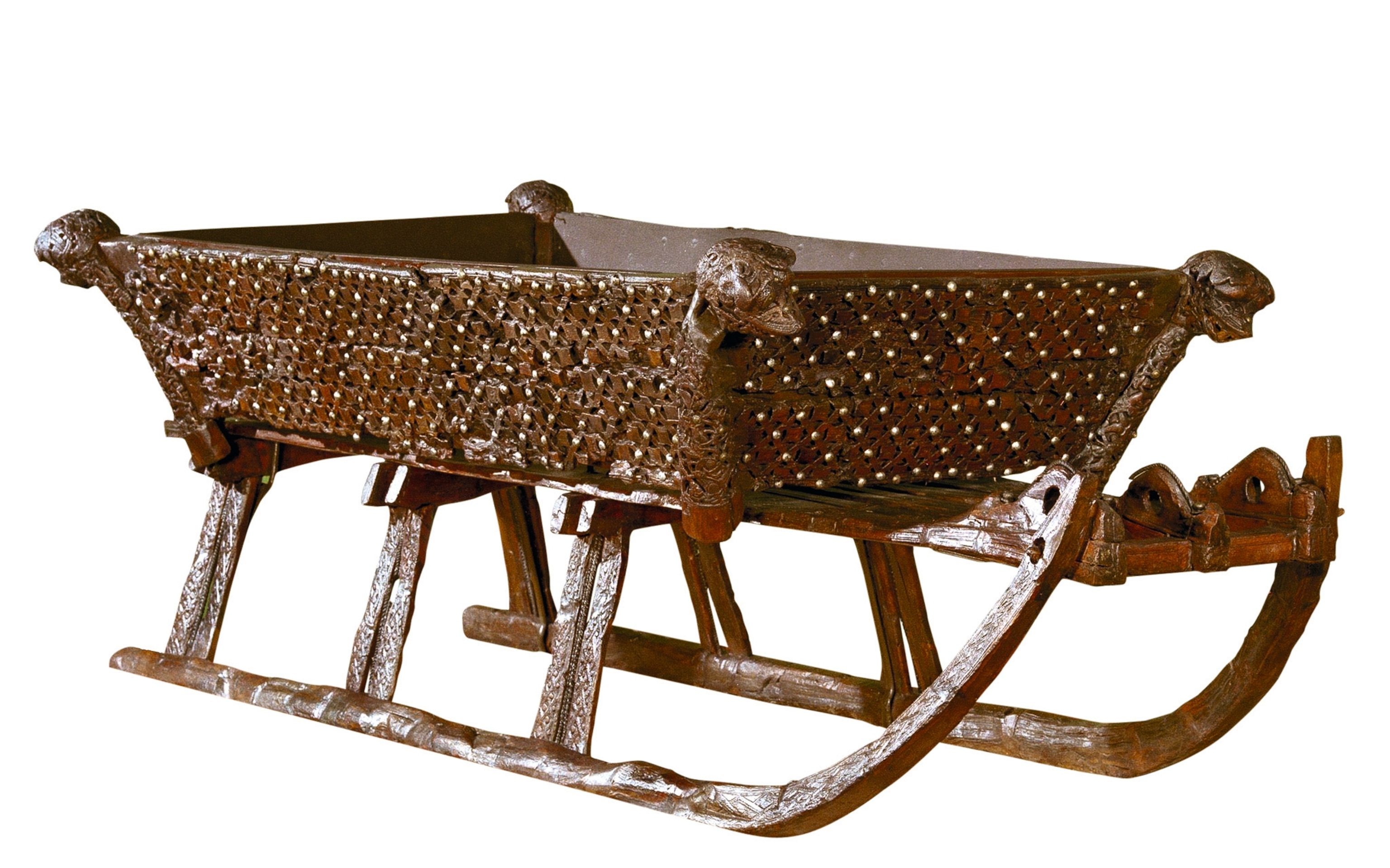 A finely carved sleigh is pictured.