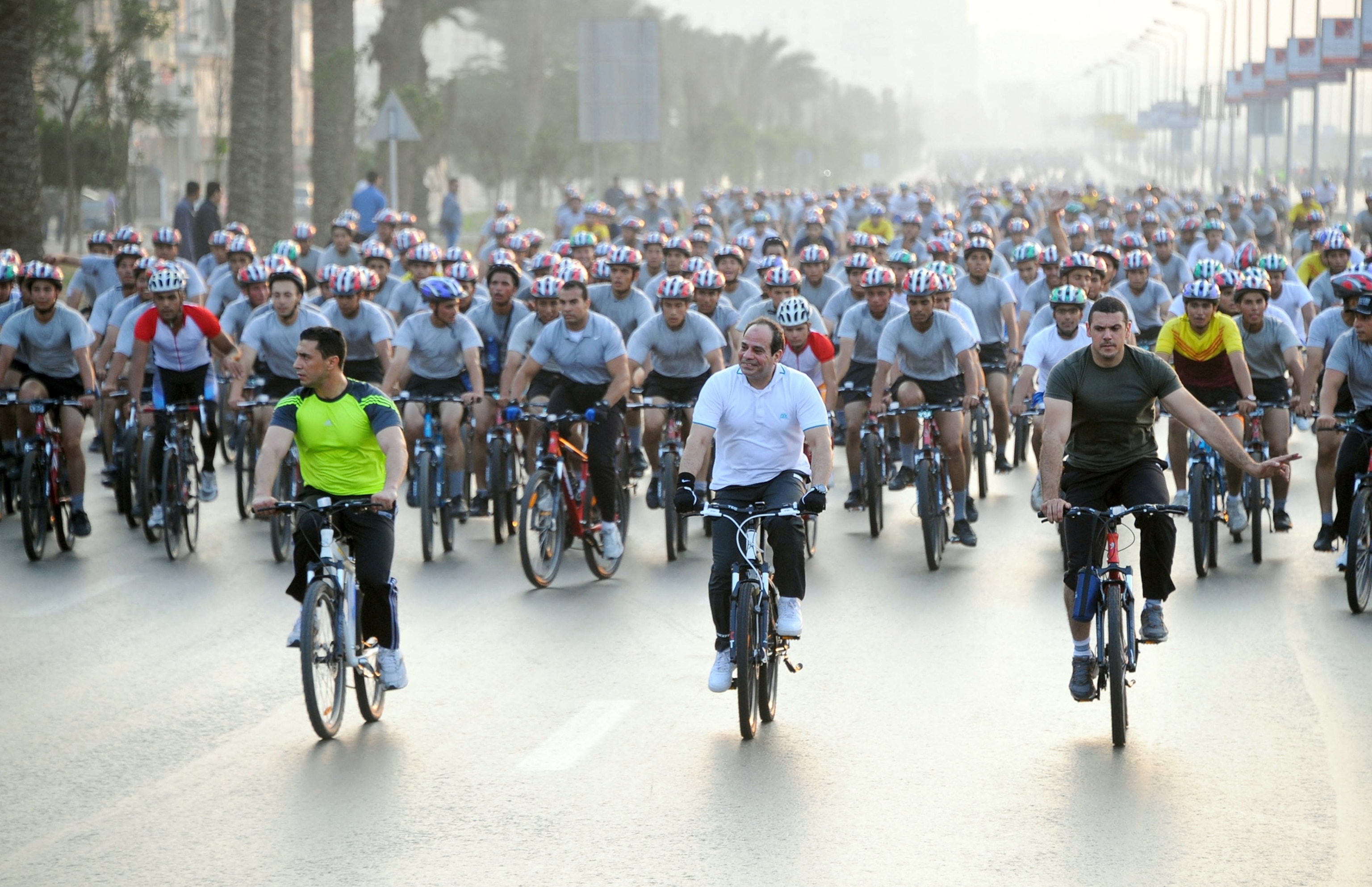 Egyptian President Abdel-Fatah al-Sisi in a bicycle marathon in Cairo, Egypt, to support low energy consumption.