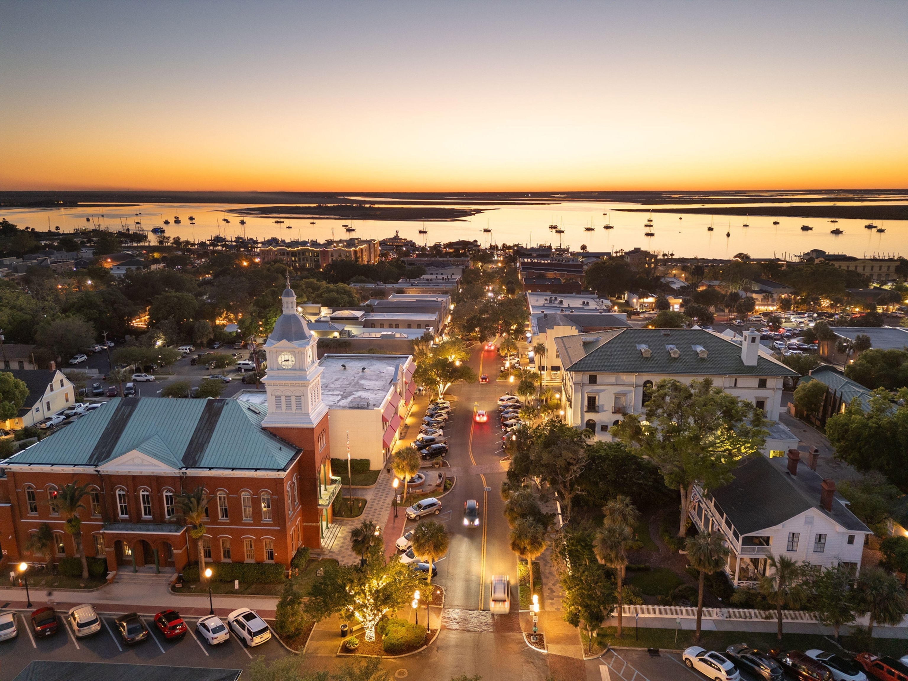 Sunset on a small town road leading out to harbor