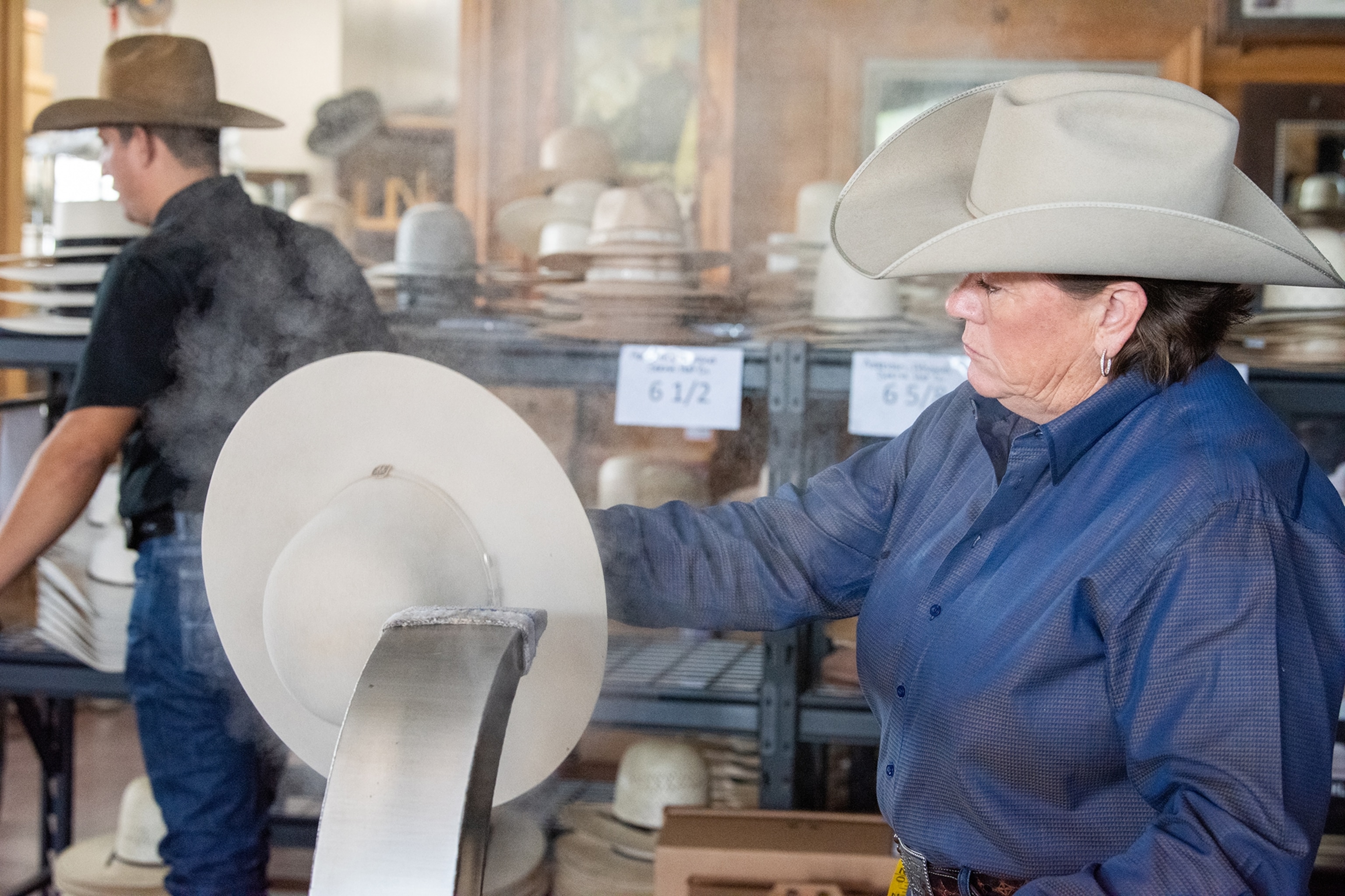 A woman works on creating a custom cowboy hat at Shorty’s Caboy Hattery in Oklahoma City.