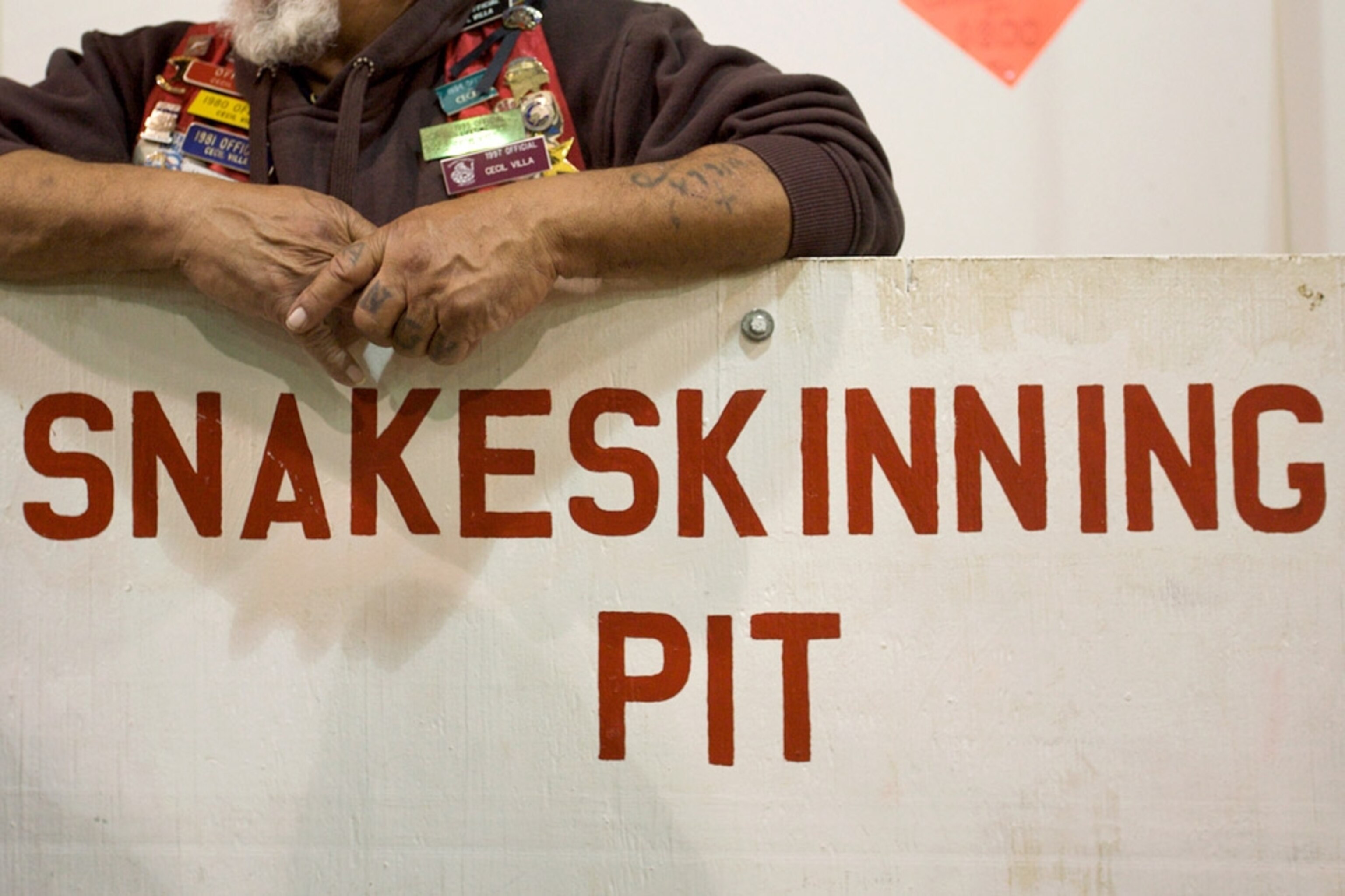 A man standing behind a large sign