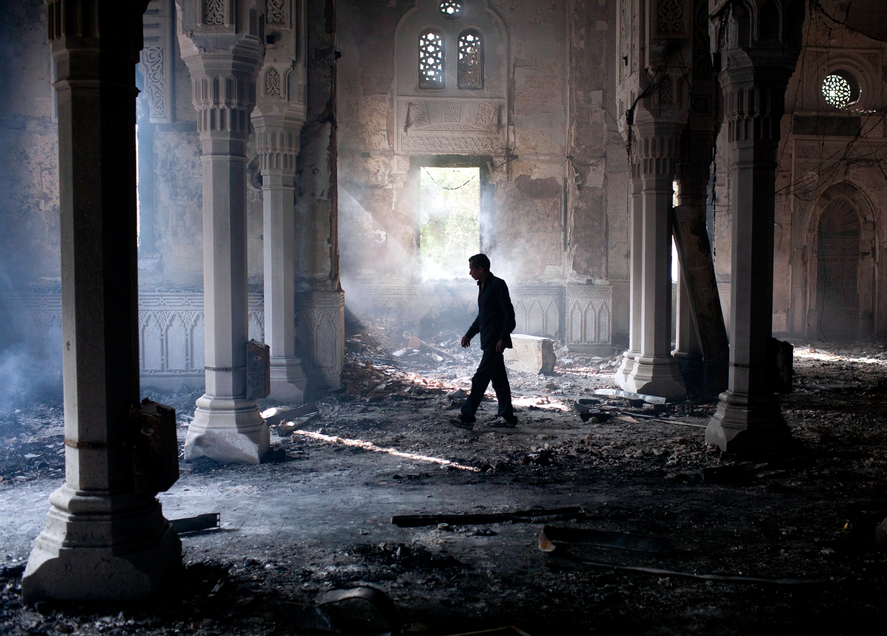Egyptian walks inside a charred mosque.