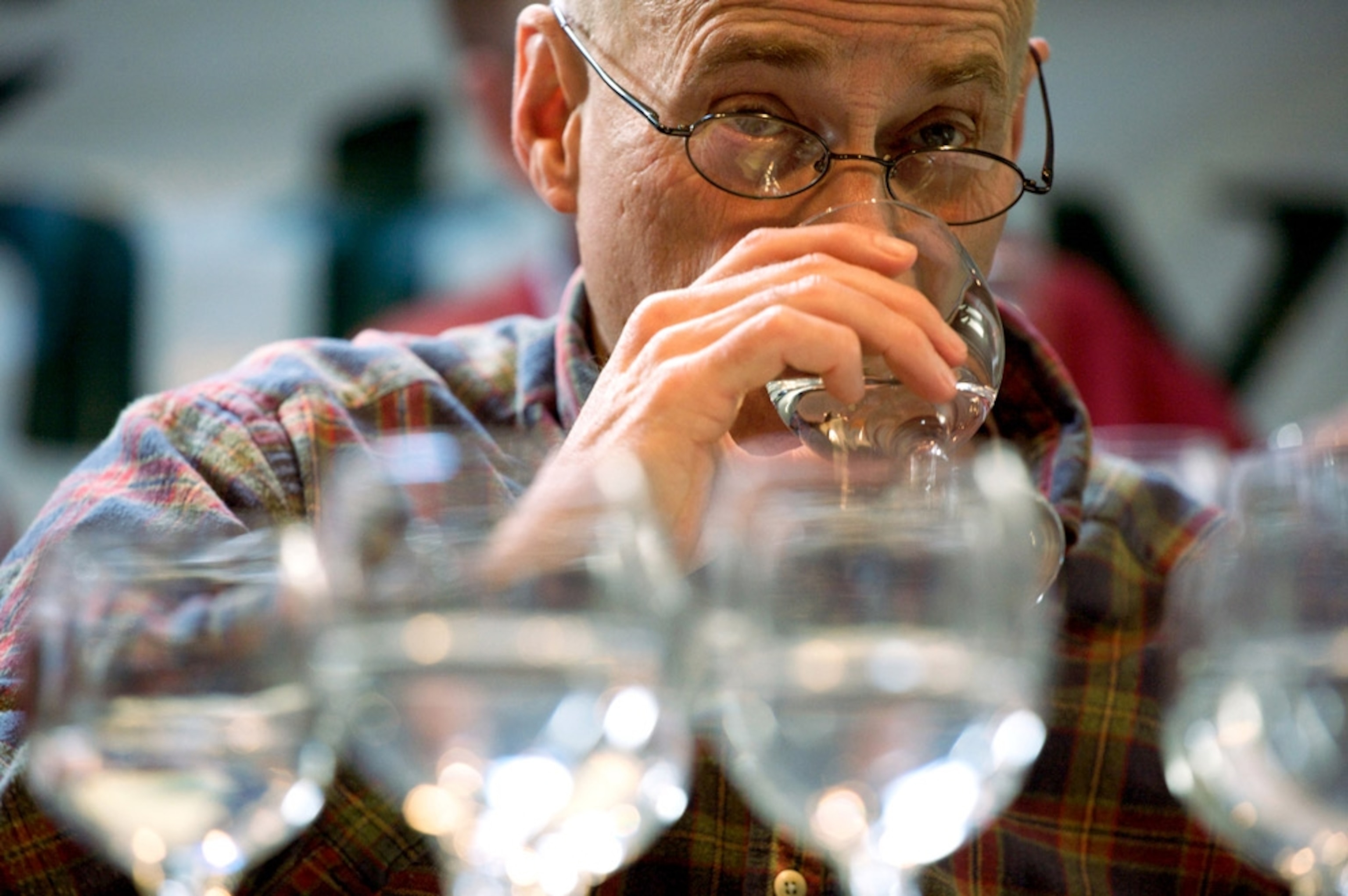 A man sipping a glass of water
