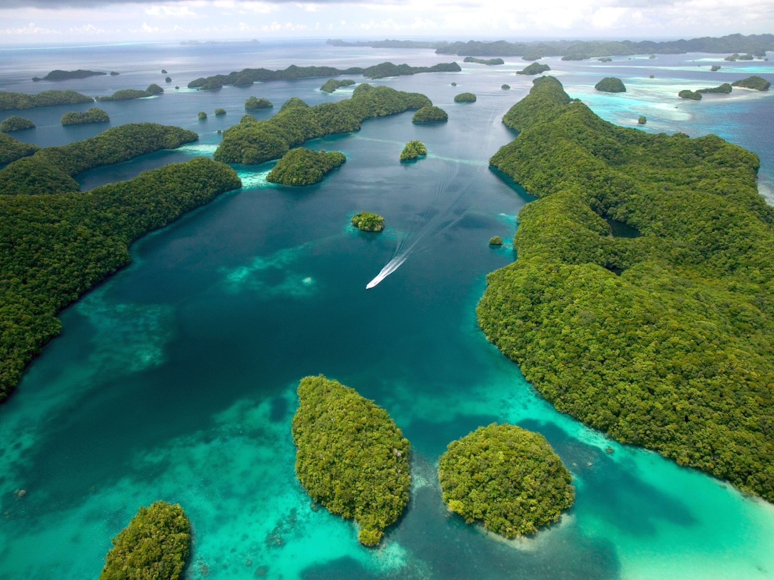 Aerial view of blue water and small green islands