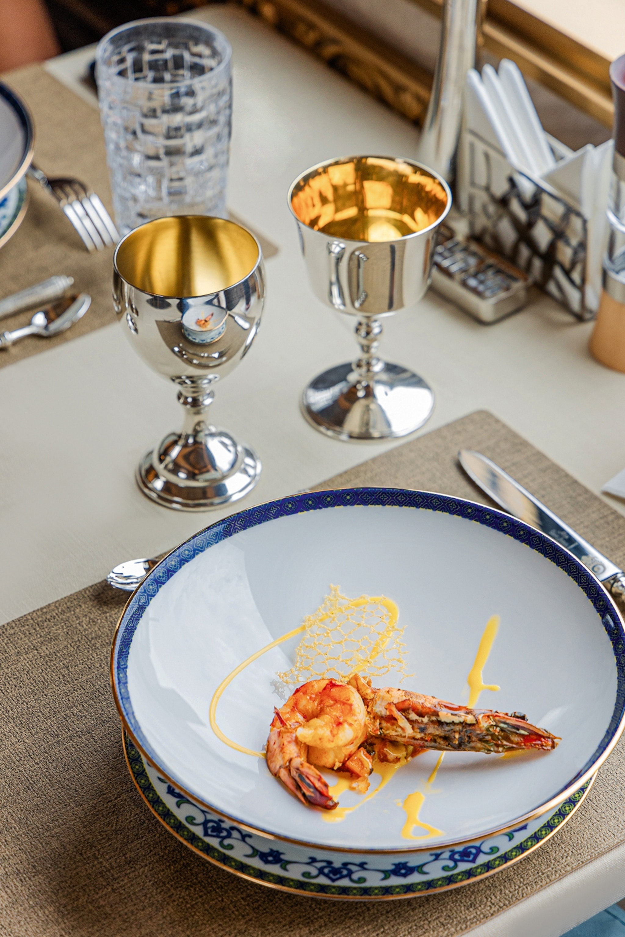 An artfully presented plate of tiger prawns and lobster.