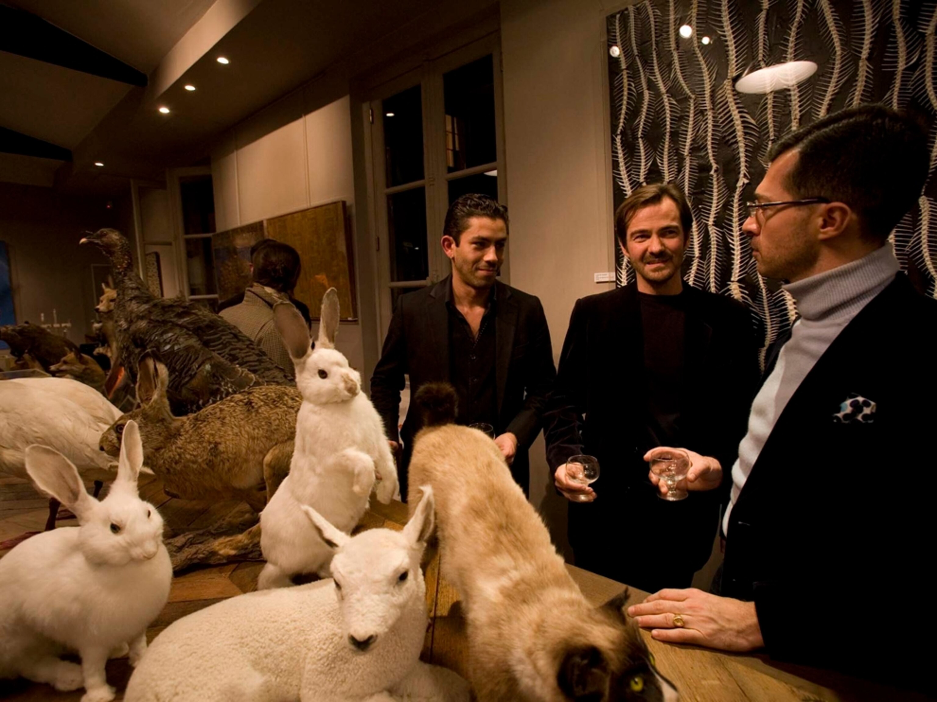 Art opening at taxidermy shop in Paris, France
