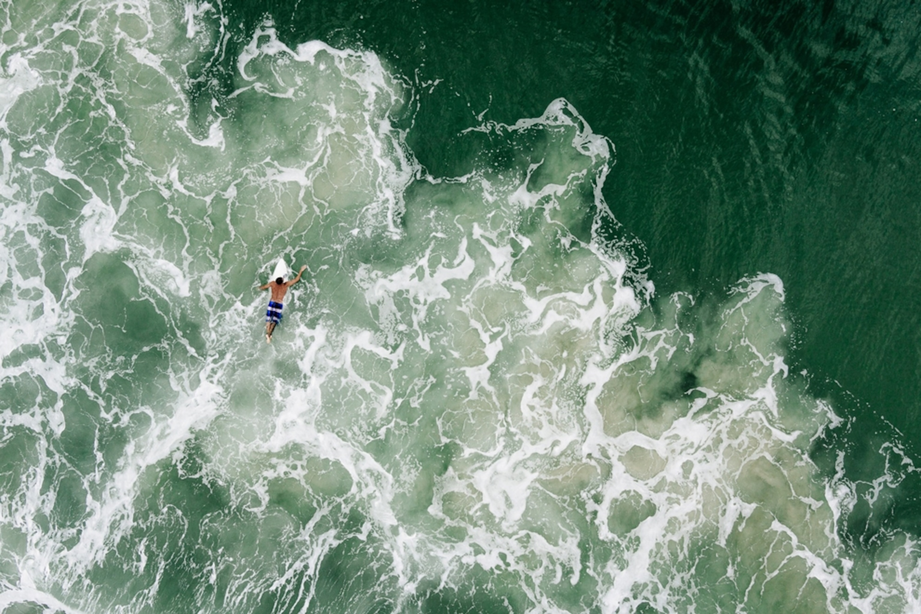 surfer at Praia Mole in Florianopolis, Brazil
