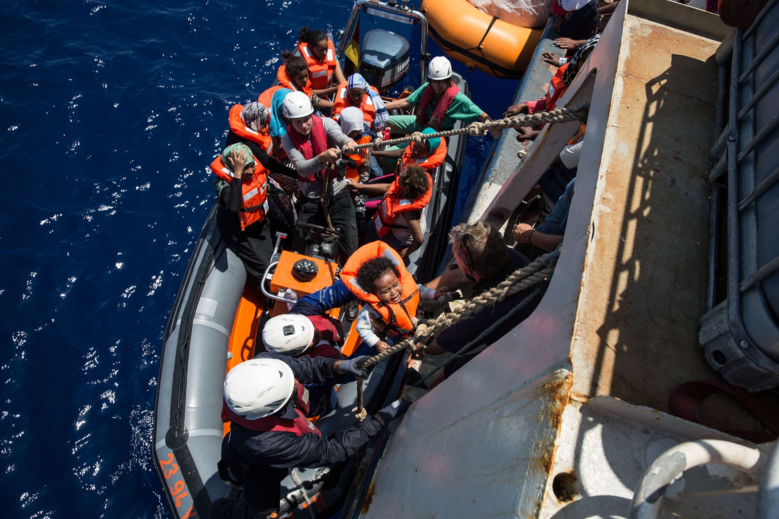 migrants on a rescue boat