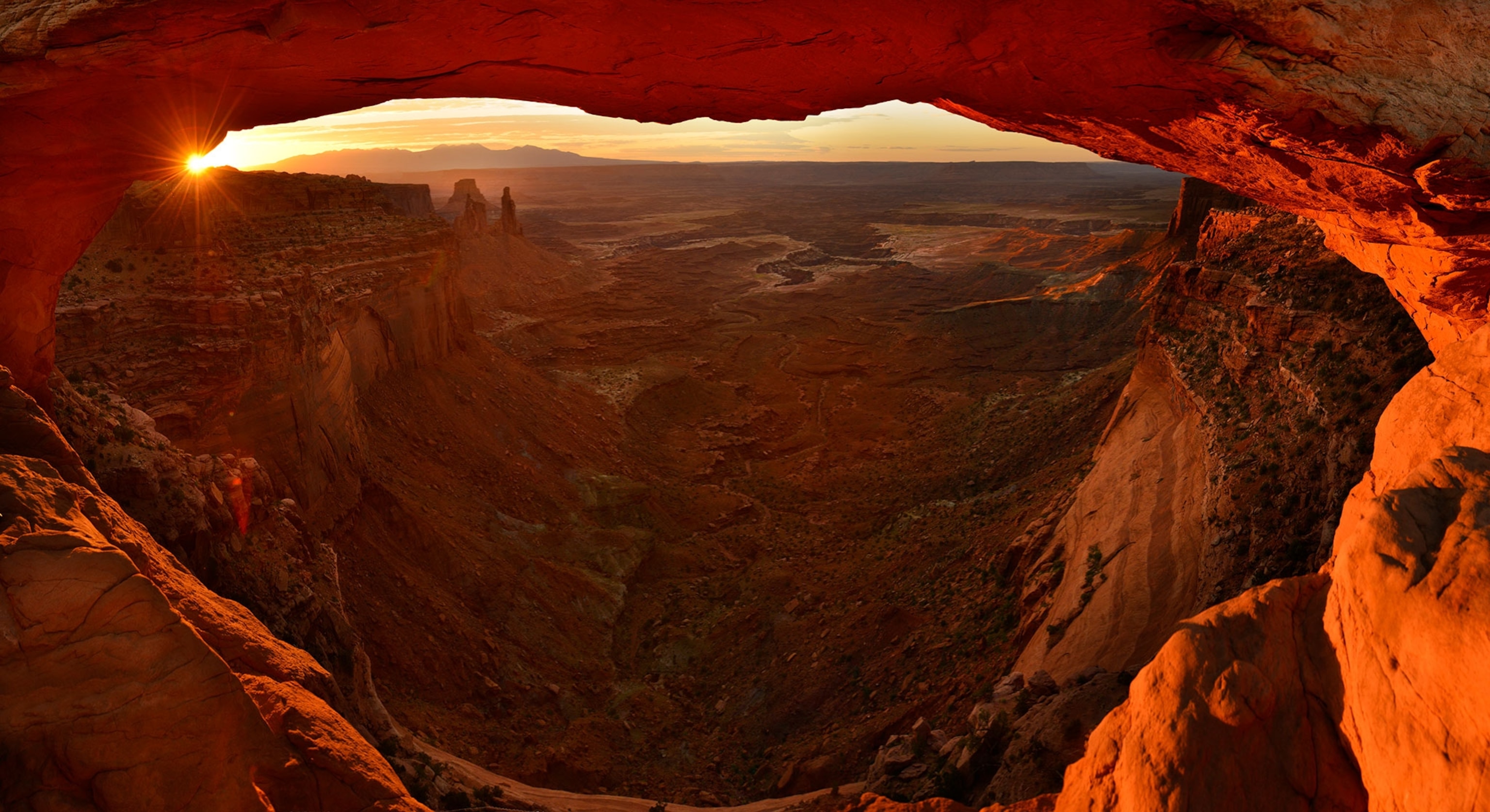 the sunrise through the Mesa arch in Canyonlands National Park