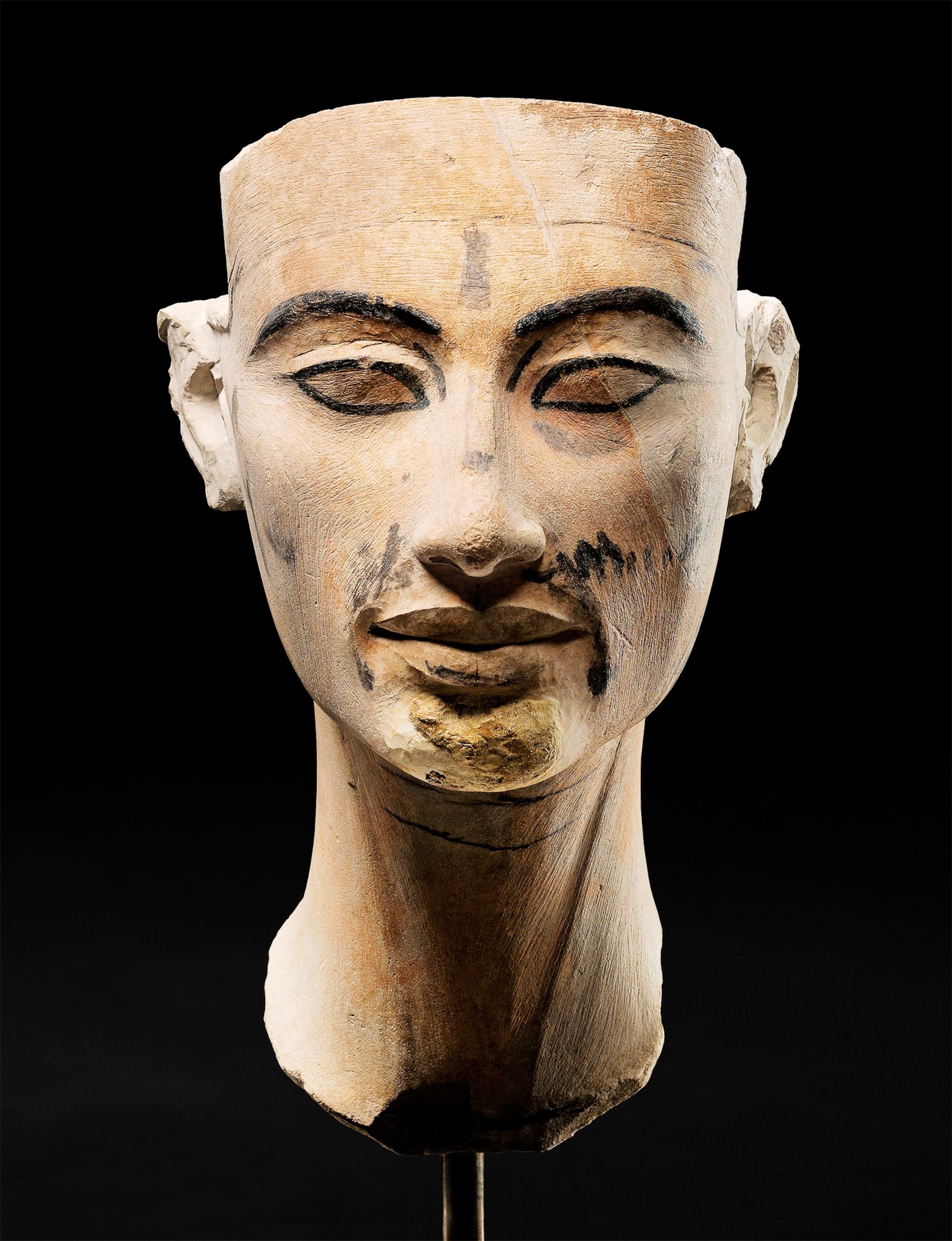 The elongated features of an unfinished bust of Nefertiti align closely to the Amarna style associated with her husband, Akhenaten. The bust is housed in the Egyptian Museum and Papyrus Collection at Berlin's Neues Museum.