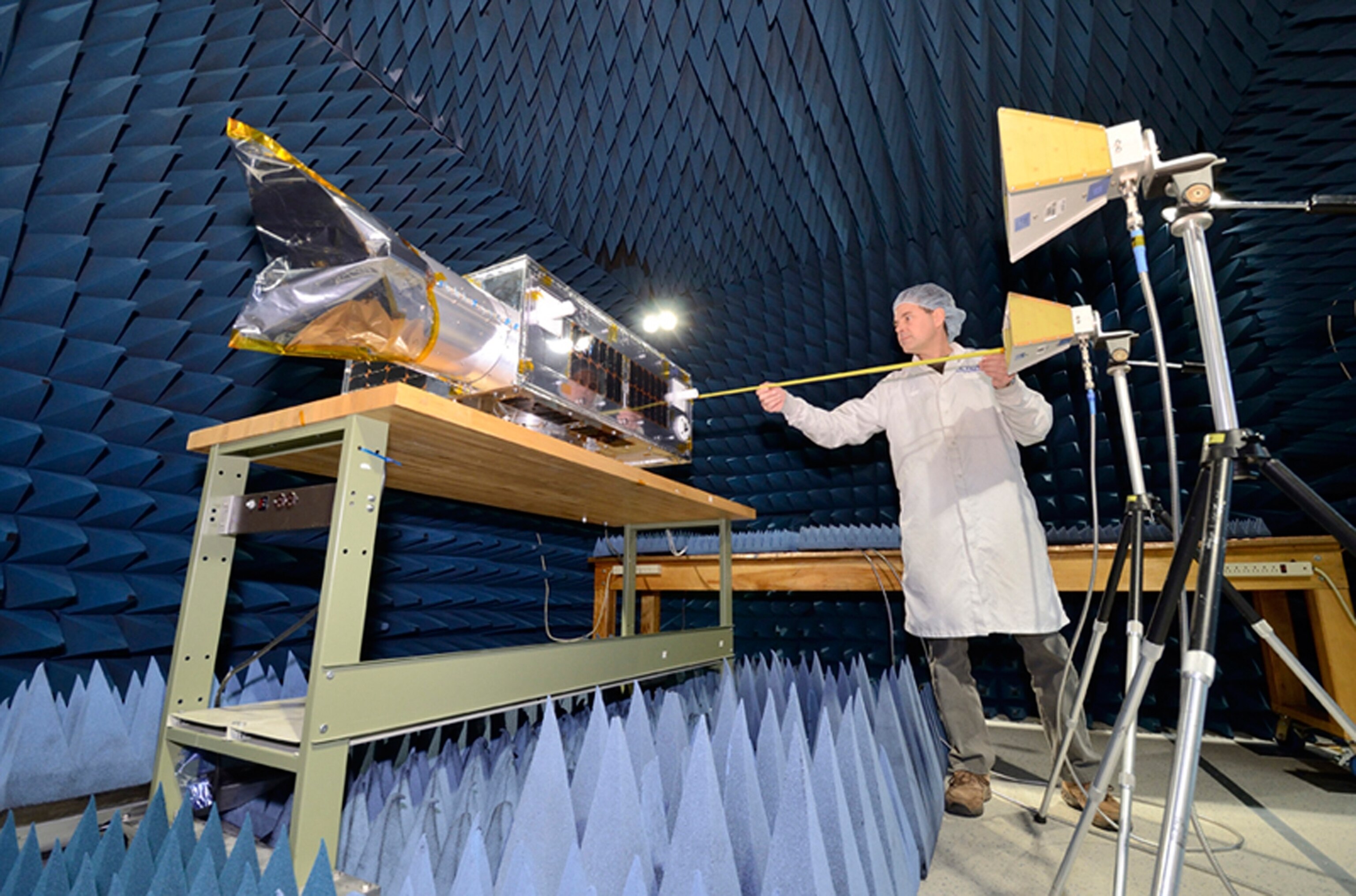 An asteroid-spotting satellite is subjected to a test chamber on Earth.