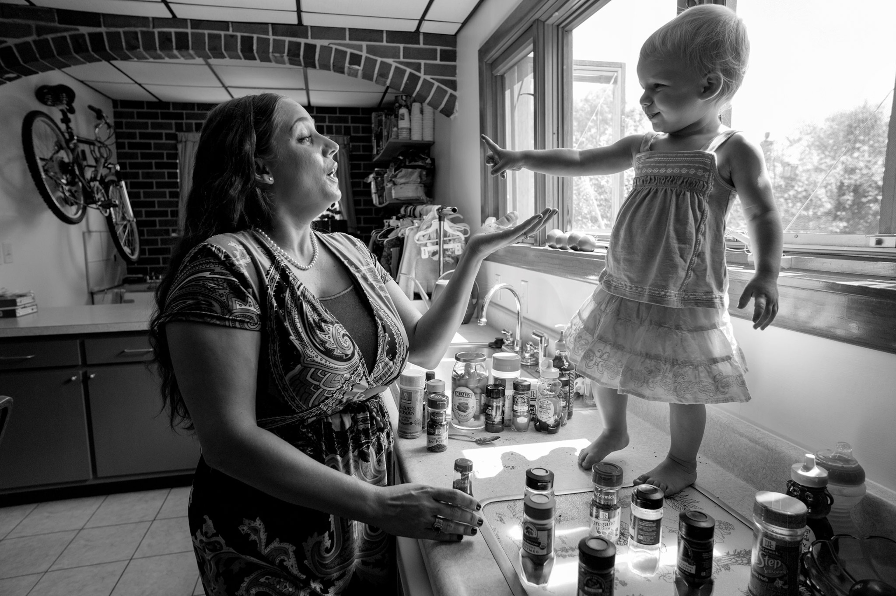 a woman talking to a baby