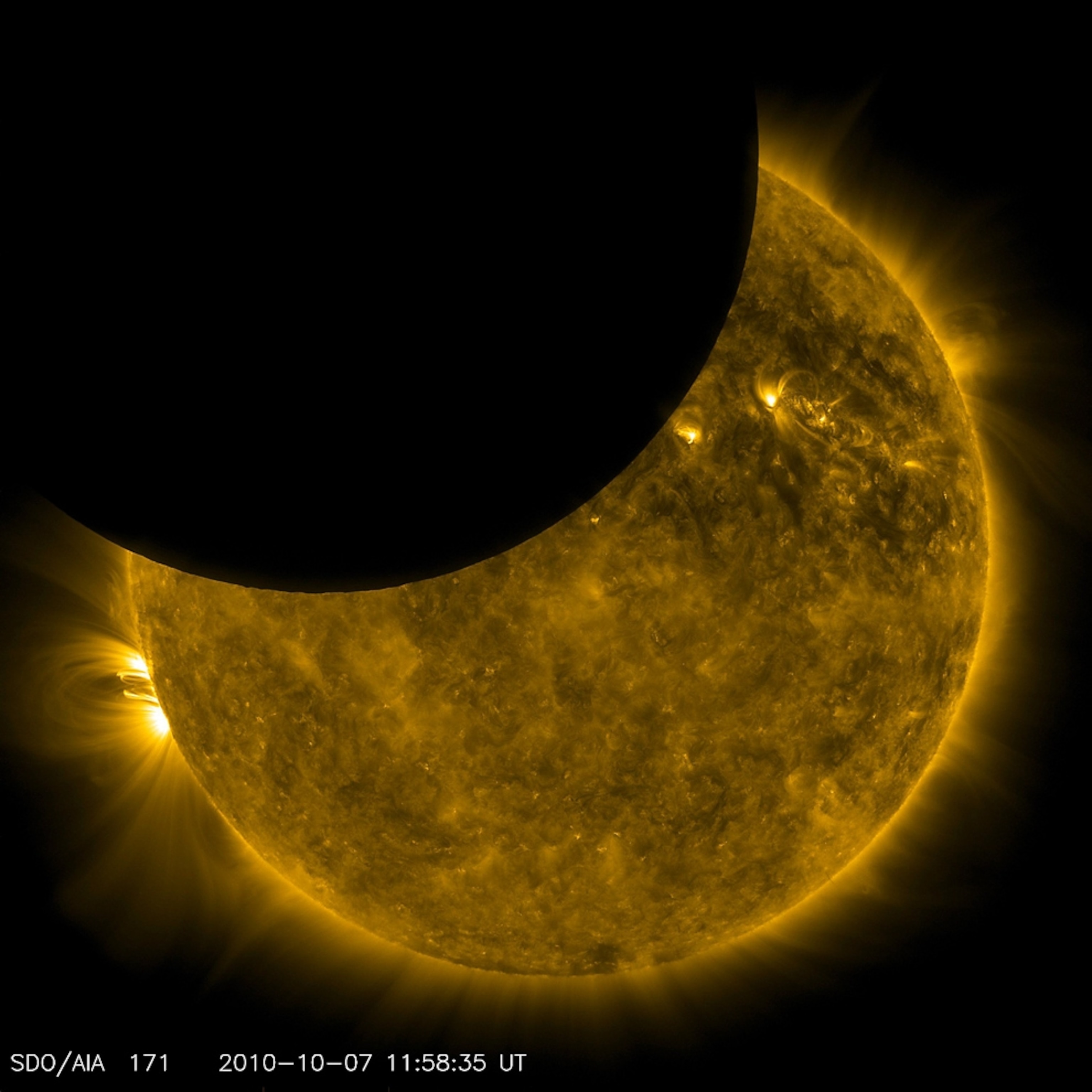 Picture of the disk of the moon partially blocking the sun.