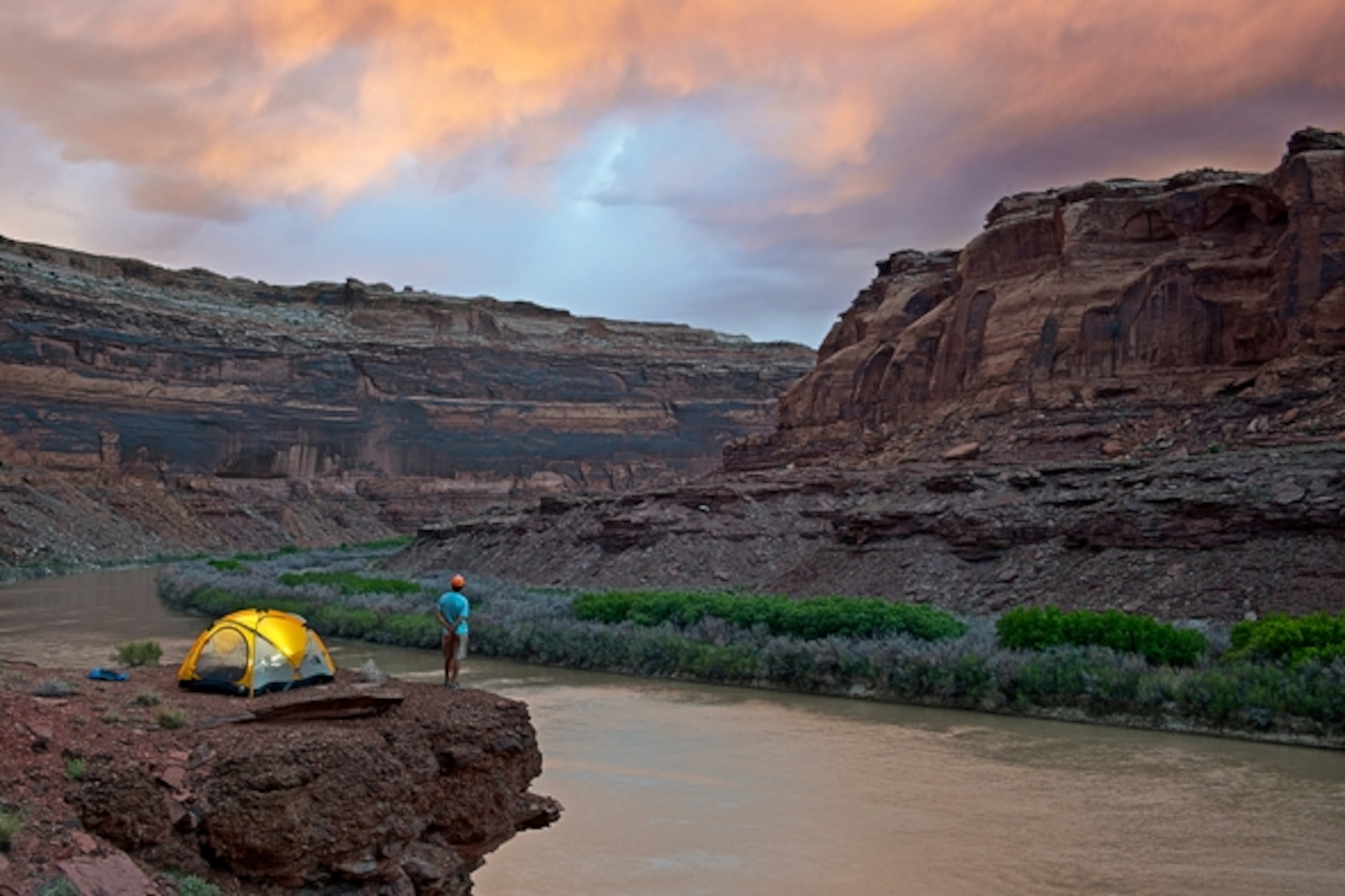 Renan Ozturk enjoys a beautiful sunset from camp on the Green River in Labyrinth Canyon, UT. Photograph by Celin Serbo