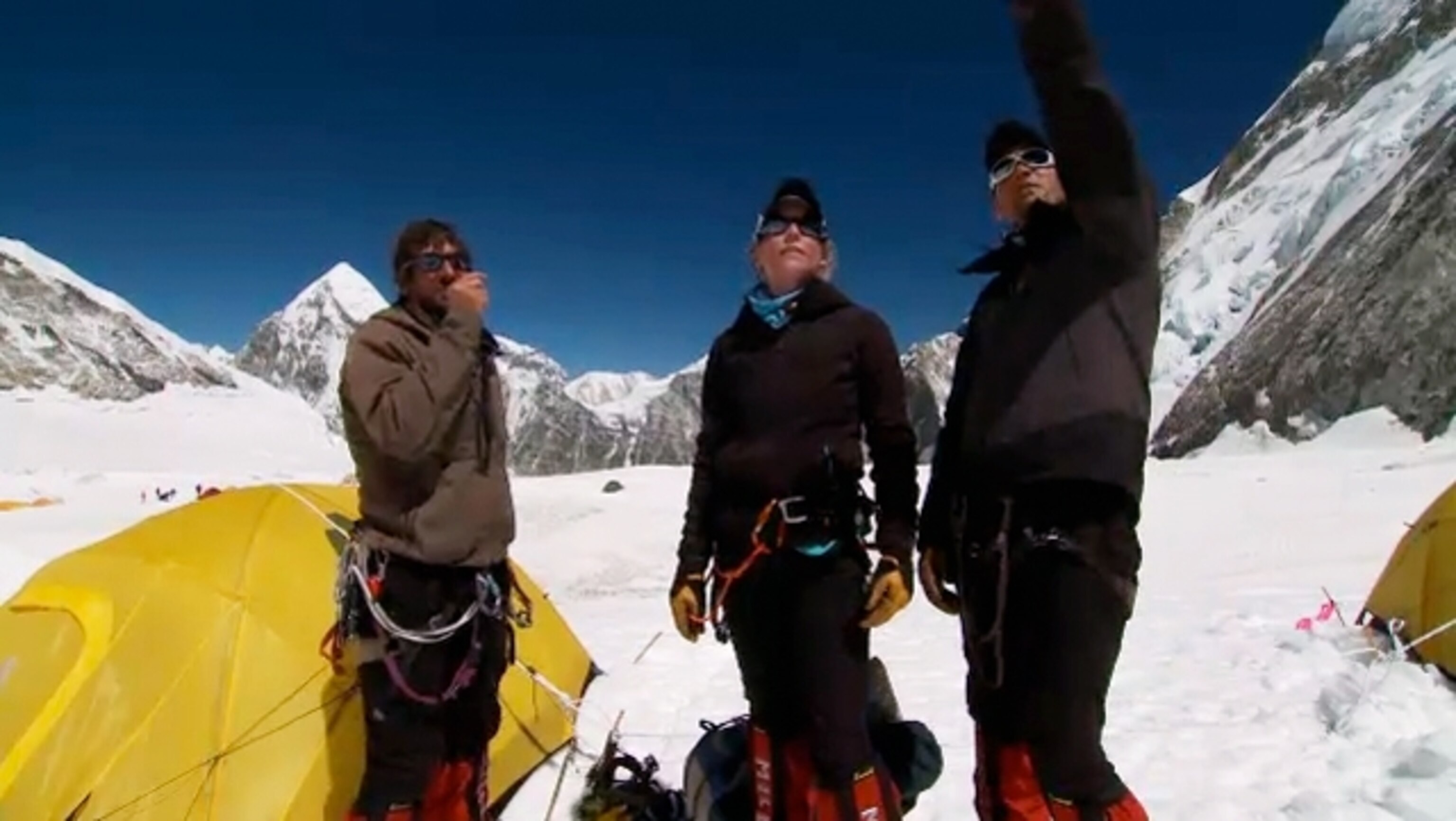 Expedition team members discuss climbing