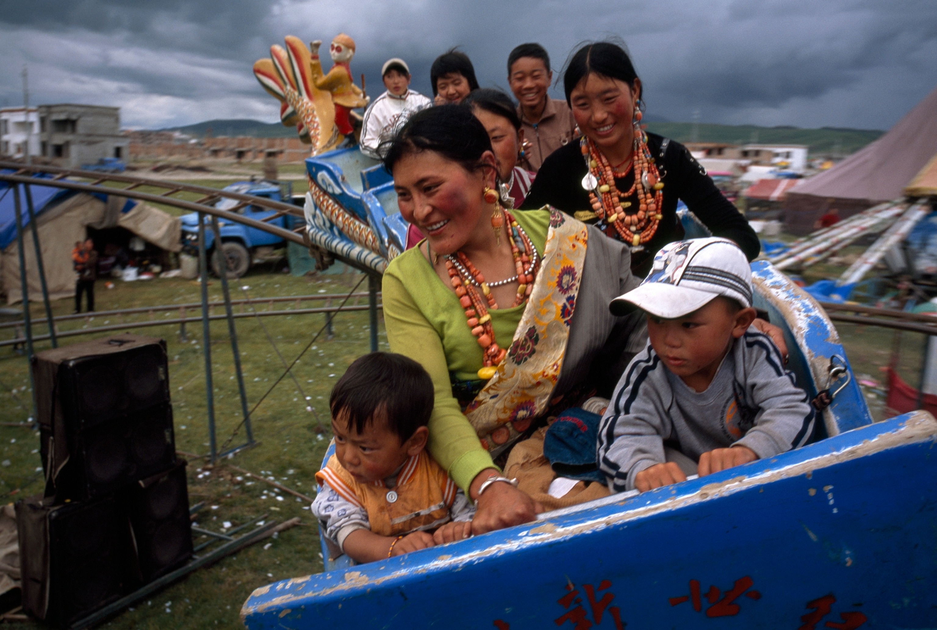 Tibetans on a rollercoaster at a fair