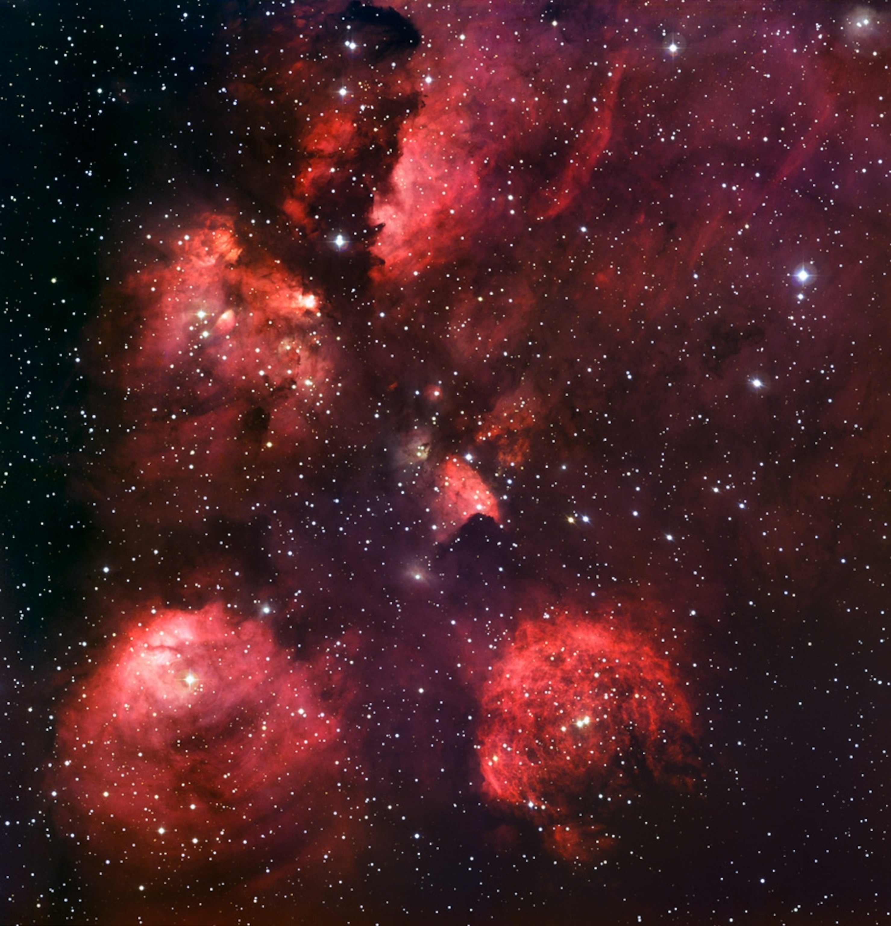 the red dust clouds of the Cat's Paw nebula