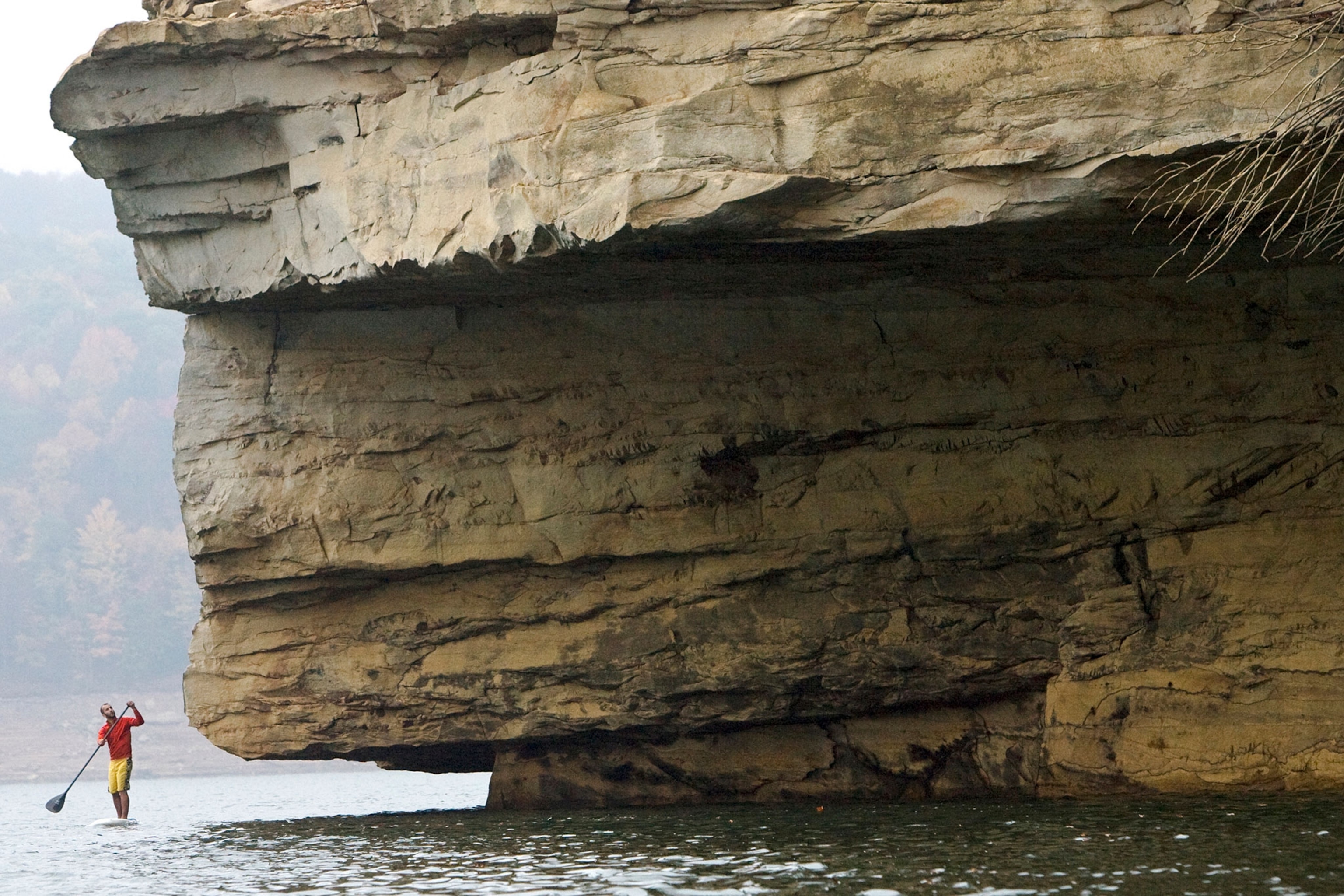 a stand-up paddle boarder on Summersville Lake near Fayetteville, West Virginia