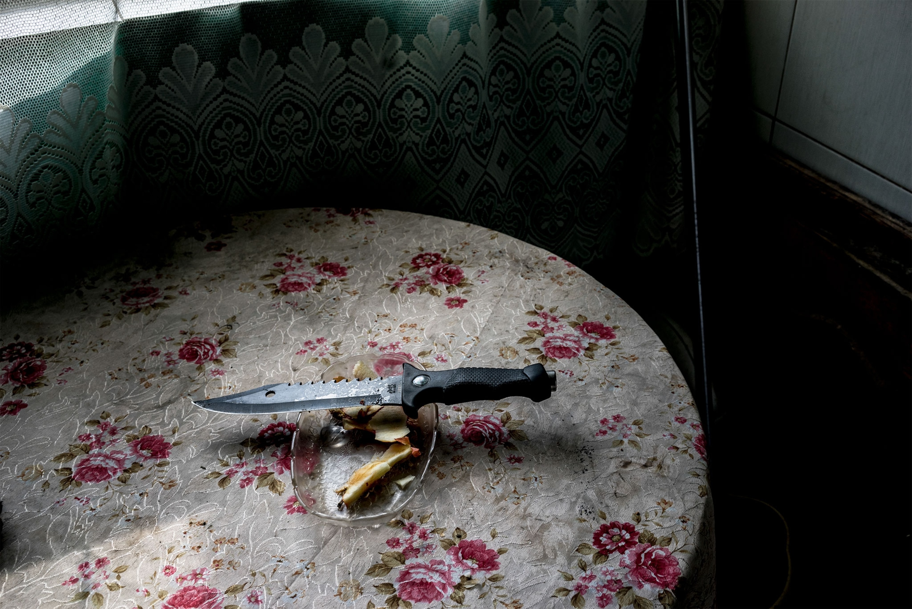 a hunter's knife on the kitchen table