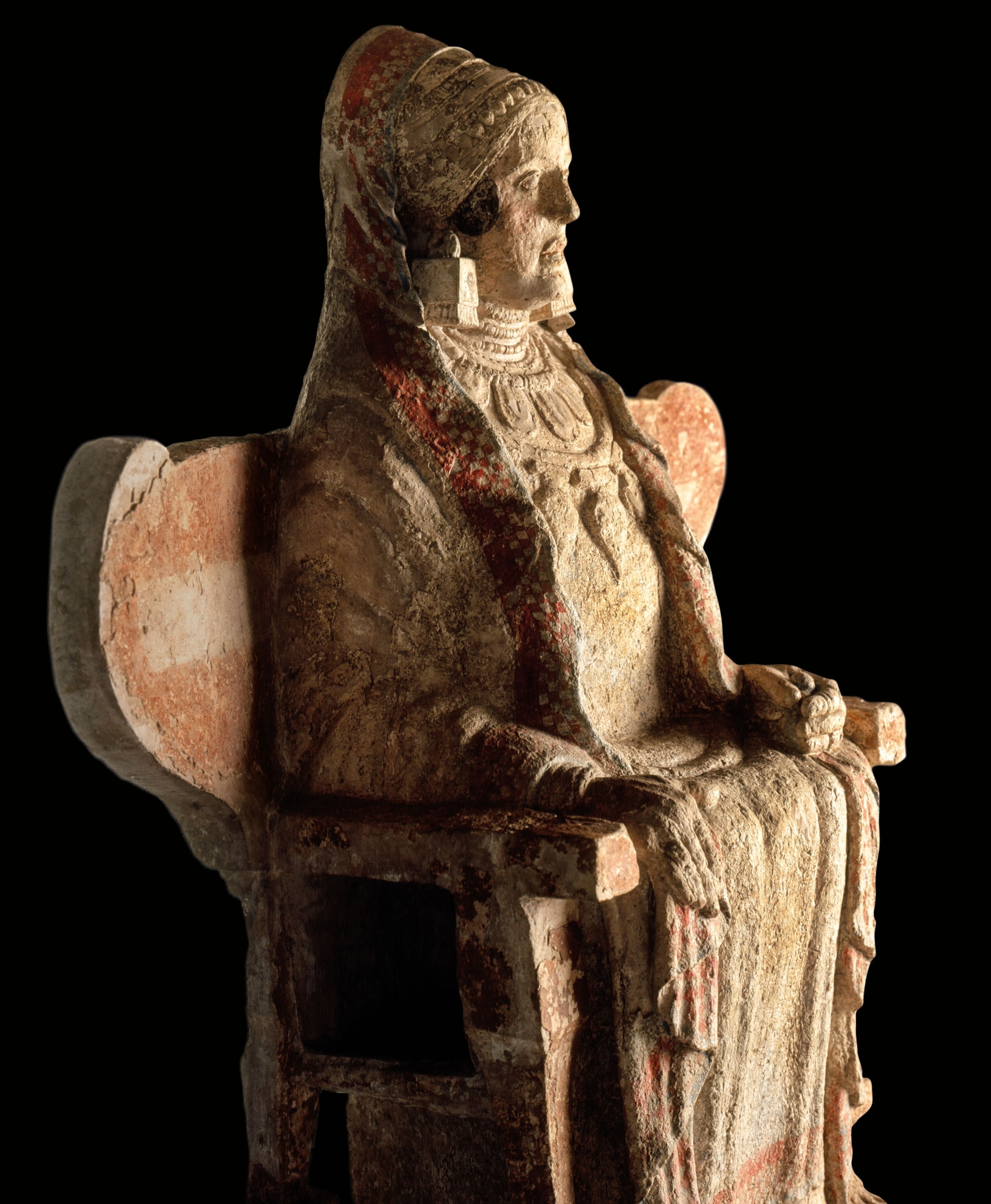 A statue of a woman seated on a winged throne