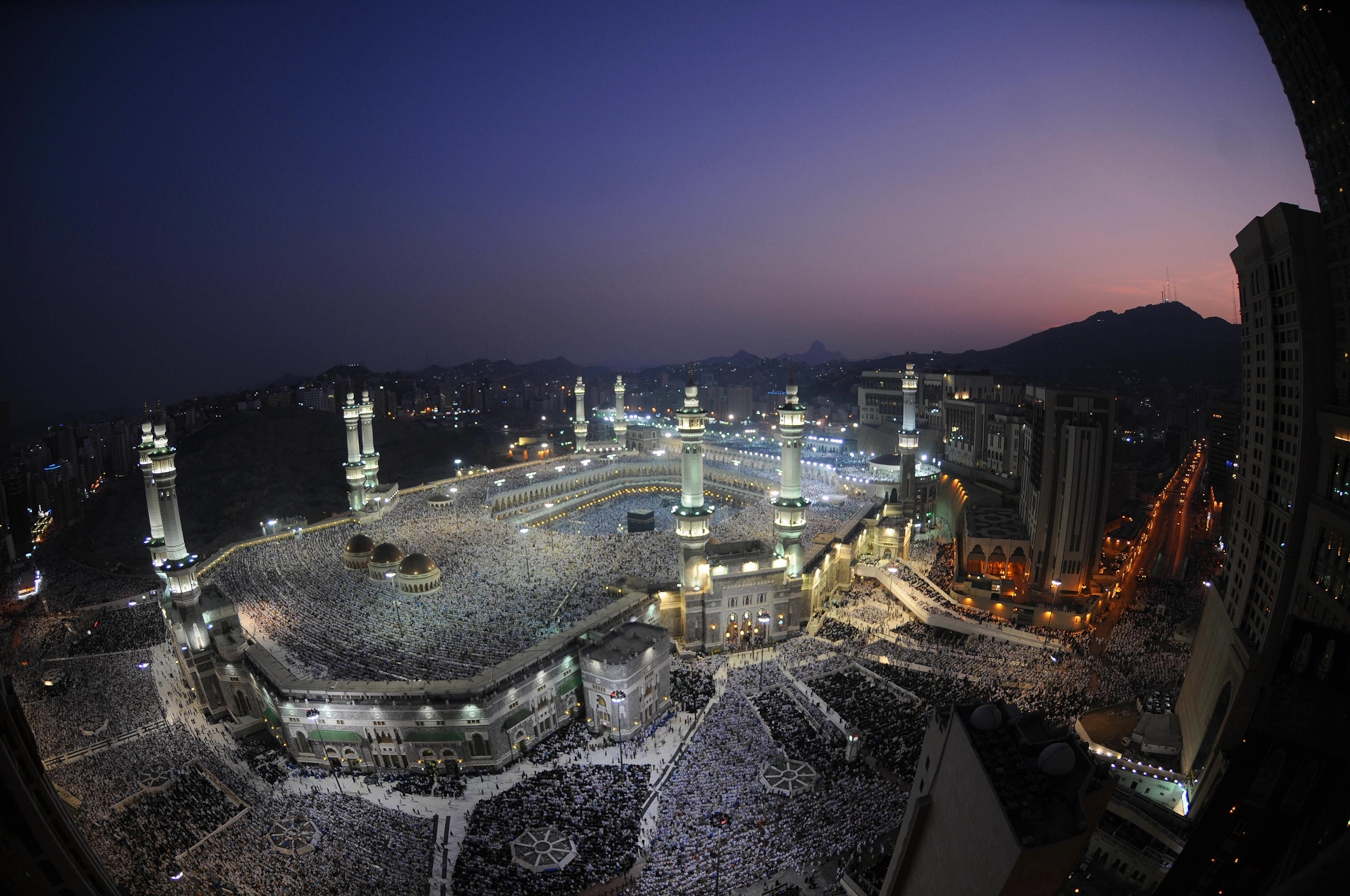 Hundreds of thousands of Muslims perform the early morning Eid al-Fitr prayer at the Masjed Al-Haram grand mosque in the Saudi holy city of Mecca on September 20, 2009.
