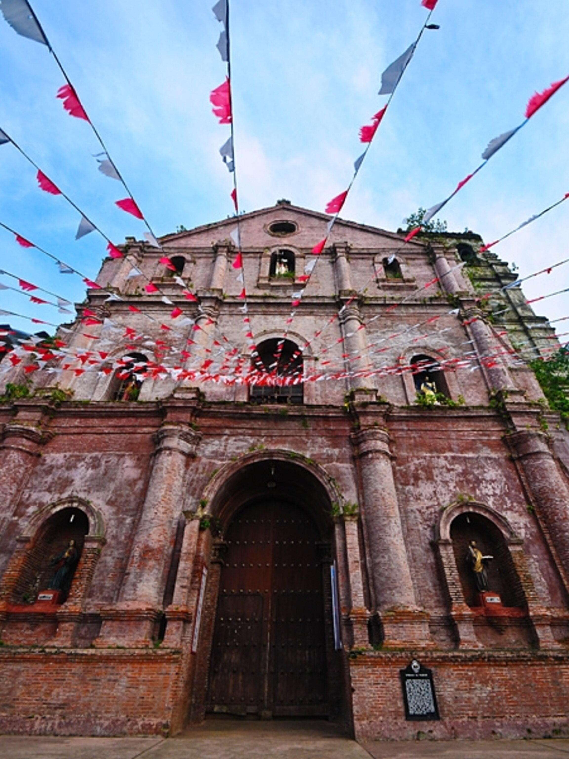 Flags near the entrance to San Gregorio Magno church, Rome, Italy