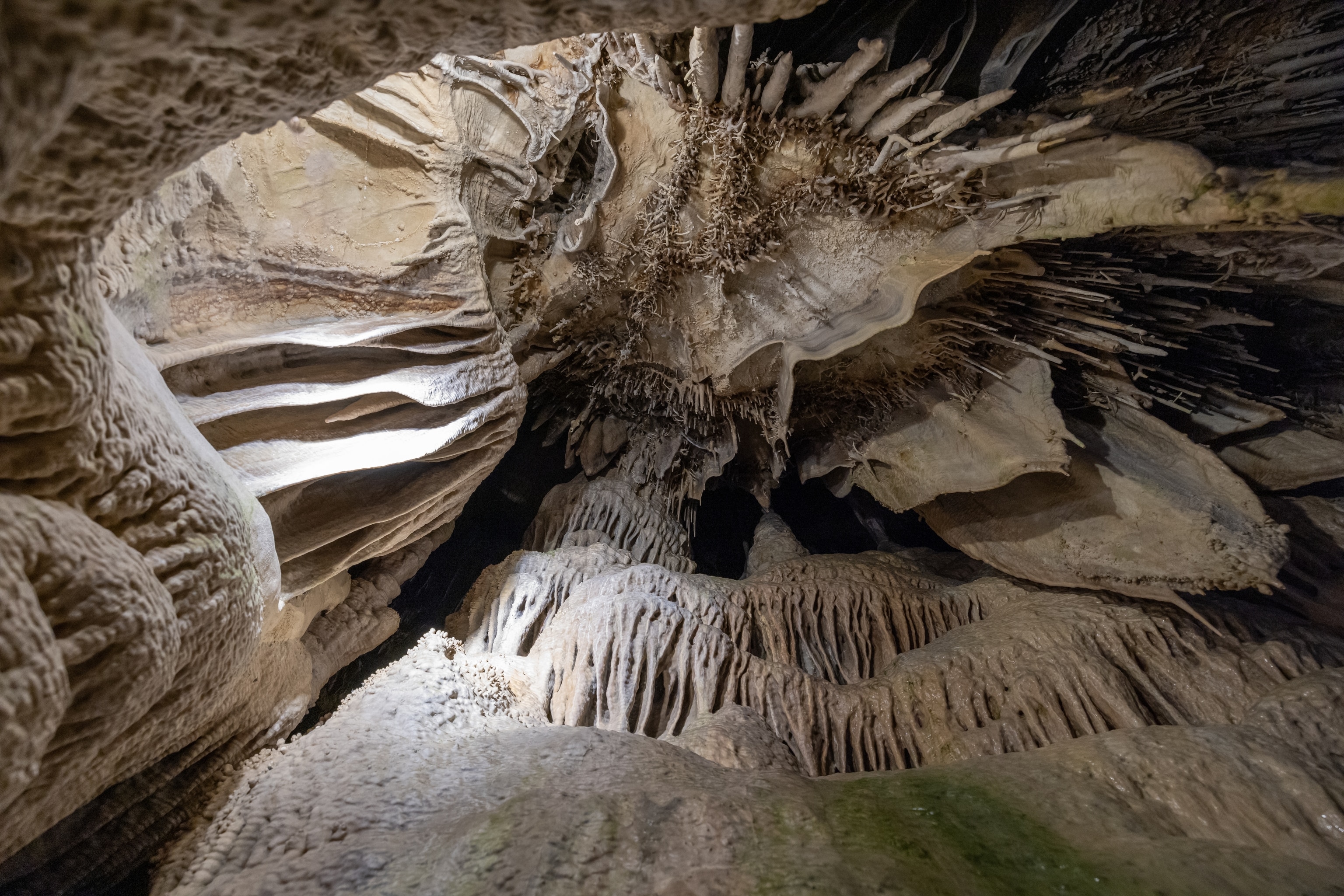 Cavernous rock formations are seen in a cave.