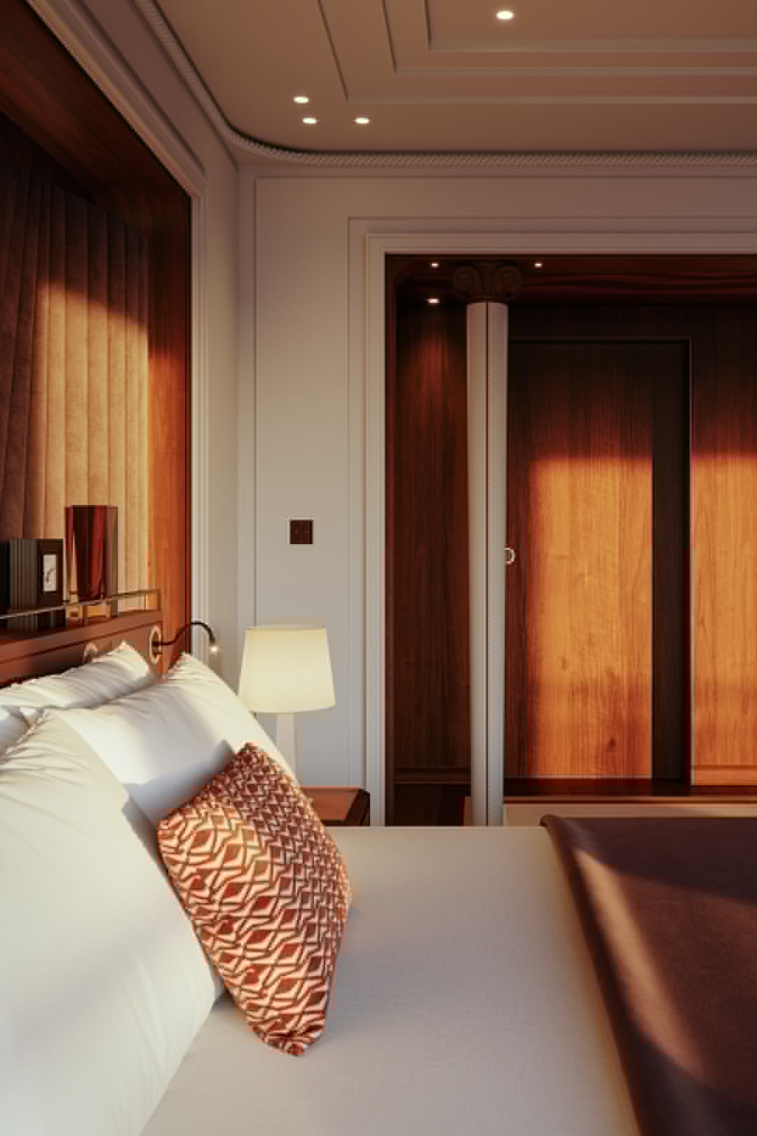 The interiors of a luxurious and golden age bedroom of a cruising yacht.