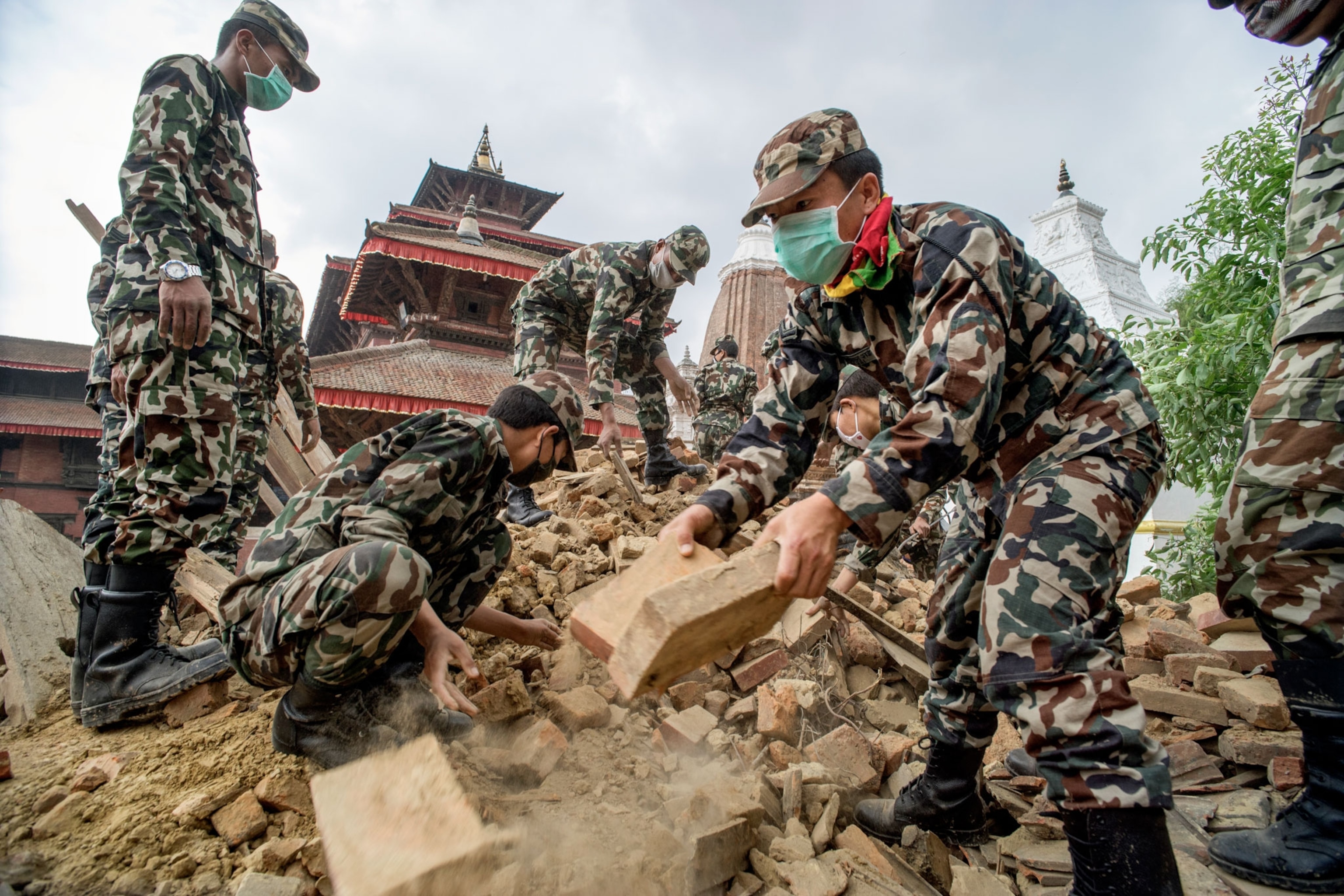 Nepalese security forces excavating ancient carvings and artifacts in Nepal