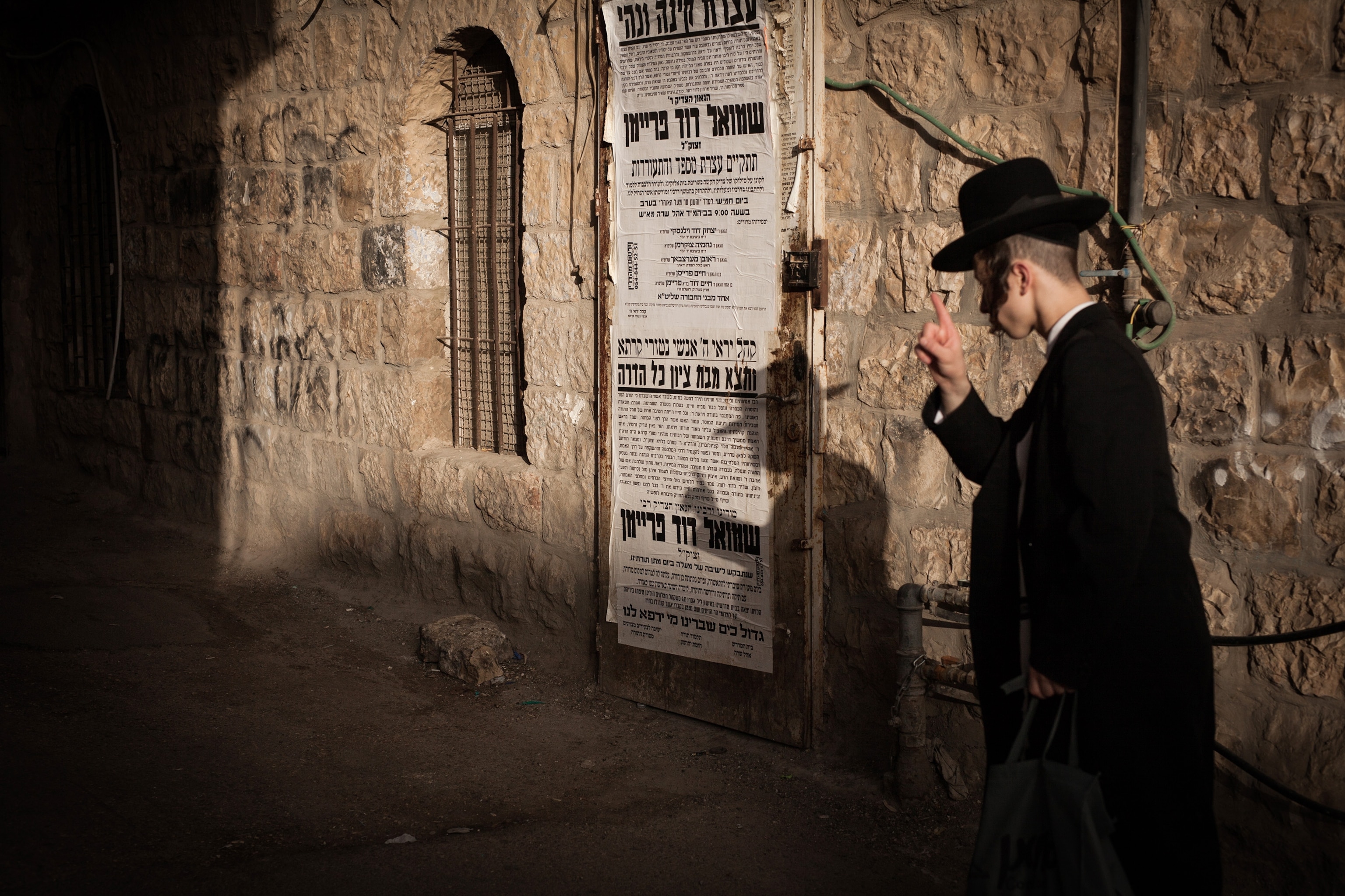 an ultra Orthodox Jewish man walking in Jerusalem, Israel